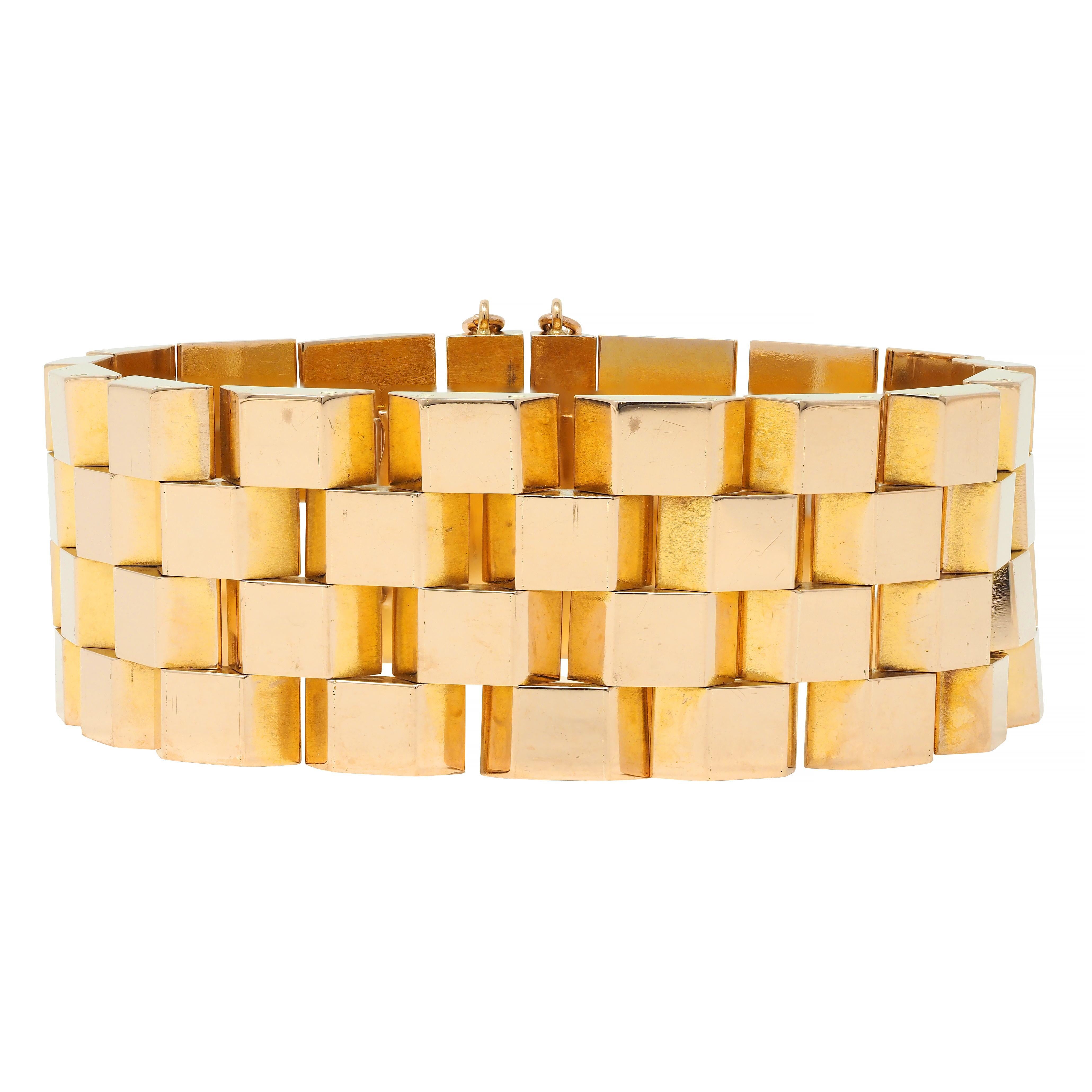 Comprise dog hinged panther style links
Geometric with faceted edges 
With high polish finish
Completed by concealed closure with safety chain 
Tested with partial French hallmarks for 18 karat gold
Circa: 1960s
Width at widest: 7/8 inch
Bracelet
