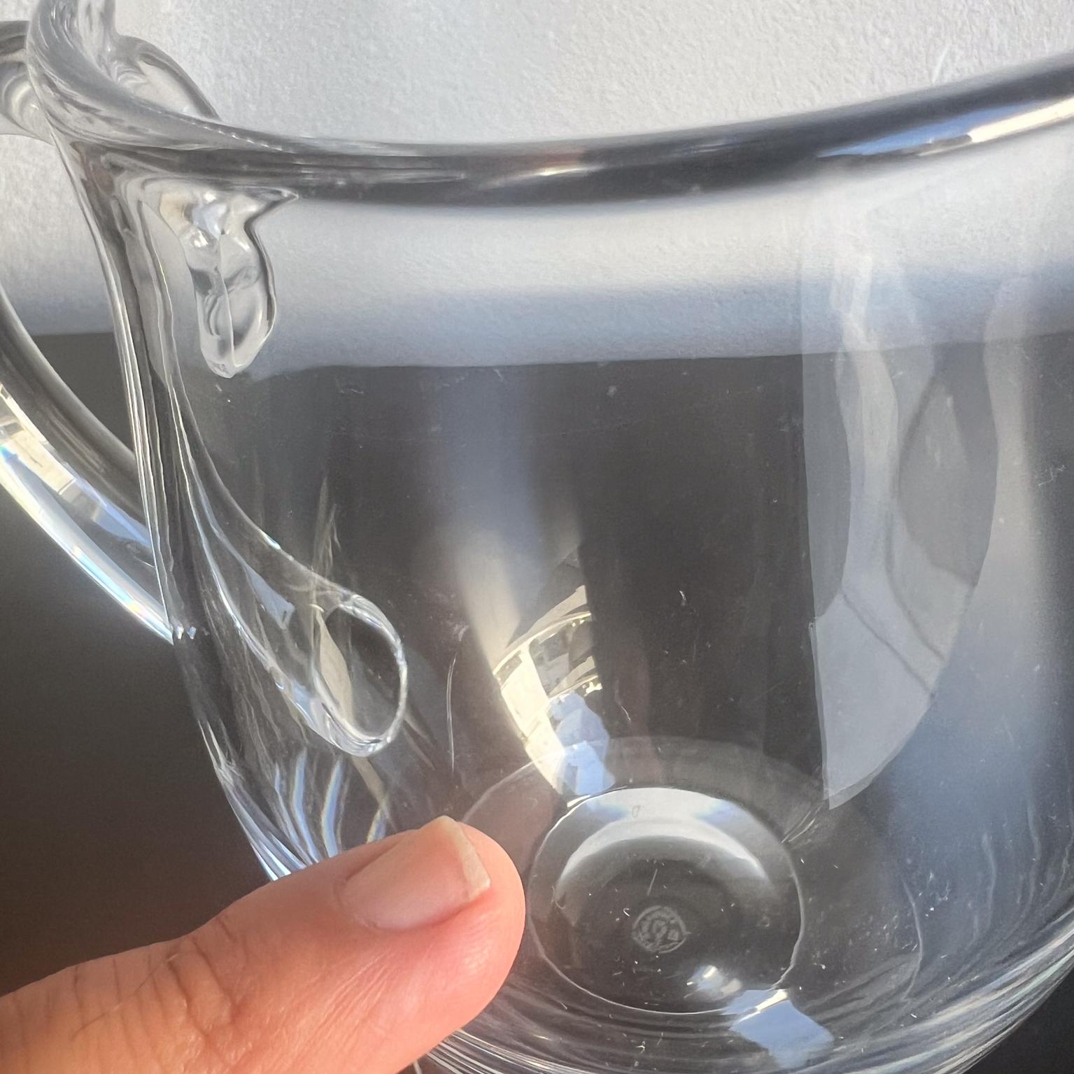 Baccarat Crystal Pitcher France
Clean Lines Art Deco Style
7.63 h x 7 d x 4.38 diameter
Stamped by maker
Unsure year of production.
Preowned original vintage with some scratches on the crystal. Unrestored.
Review images listed.