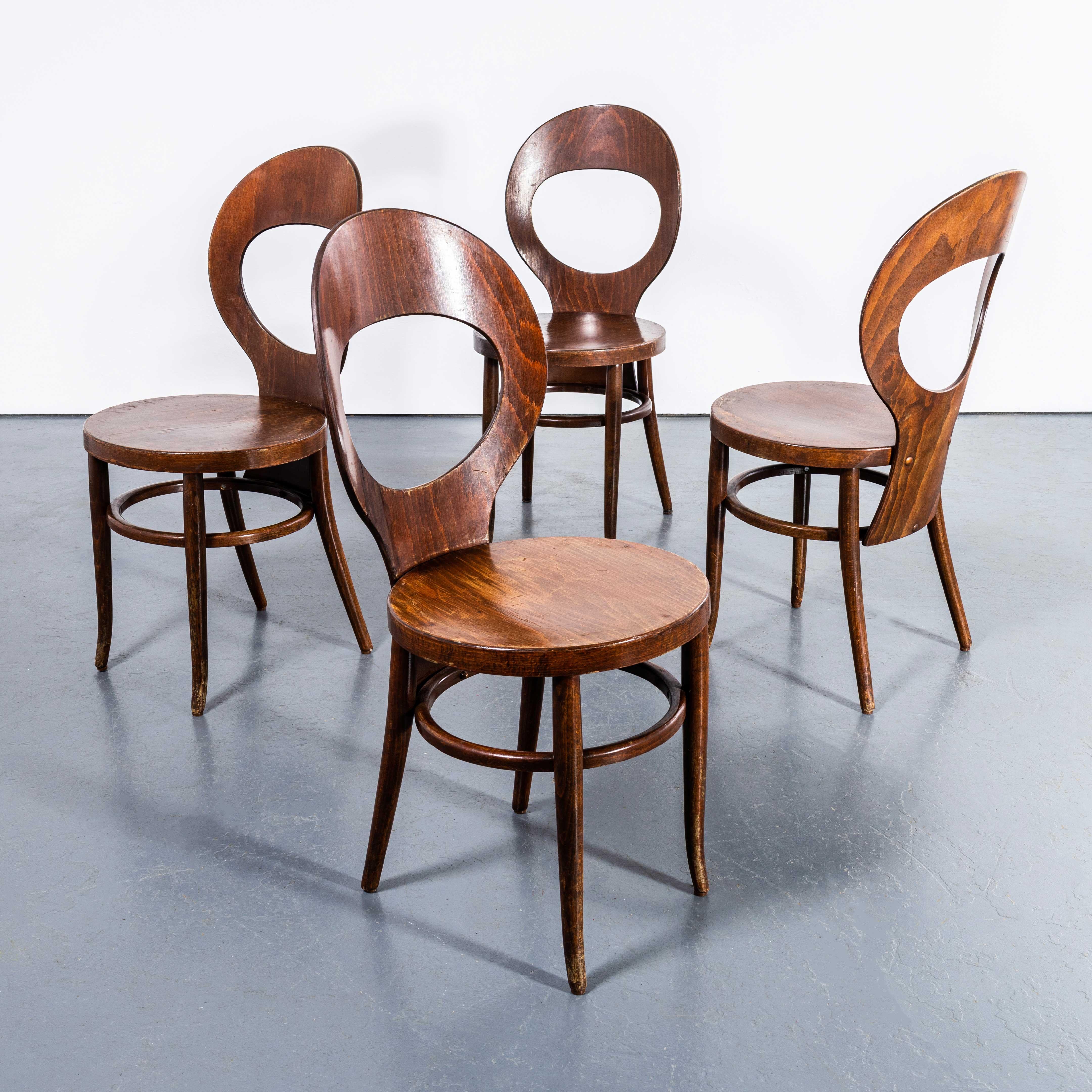 1960's French Baumann Bentwood Dark Moutte Dining Chair - Set Of Four. 
Classic beech chair made in France by the Baumann. Baumann is a slightly off the radar French producer just starting to gain traction in the market. Baumann was founded in 1901,