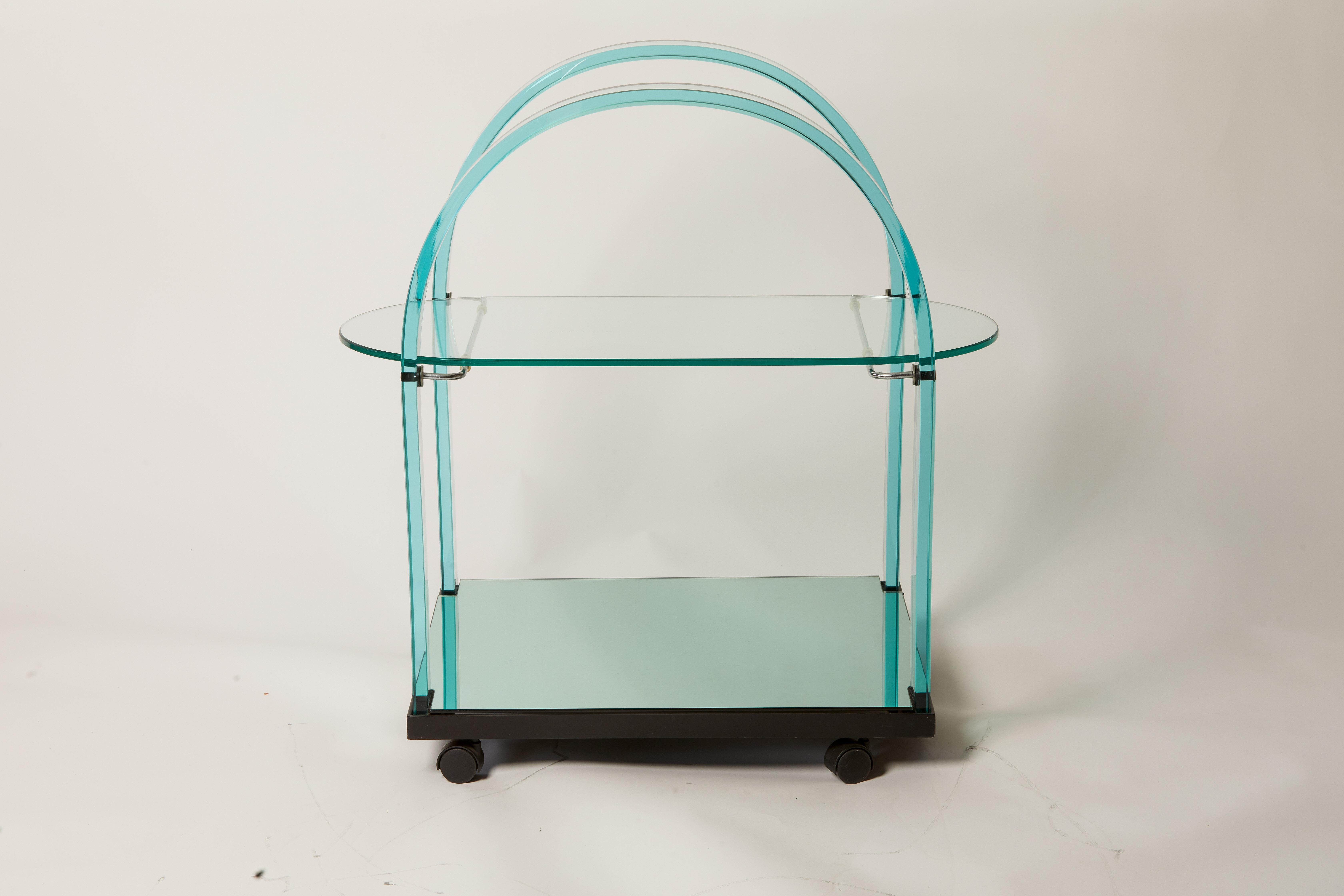 1980s French bent glass bar cart featuring mirrored shelf and metal detailing.