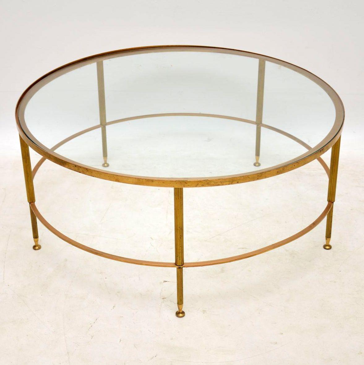 A beautiful and impressive circular brass coffee table with an inset glass top, this was made in France and dates from the 1960s. It’s very well made and in lovely vintage condition, with only some minor surface wear to be seen.

Measures: Width
