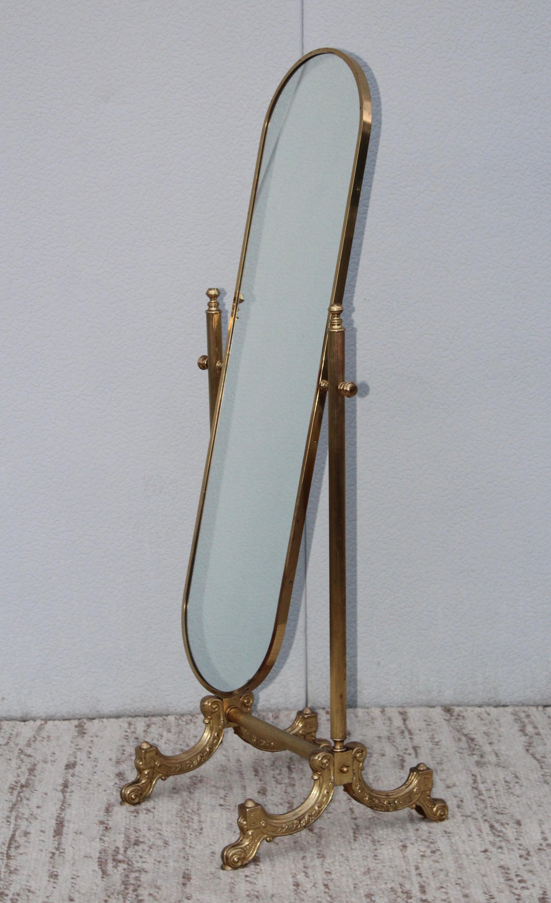 1960s French cheval oval mirror with brass stand.