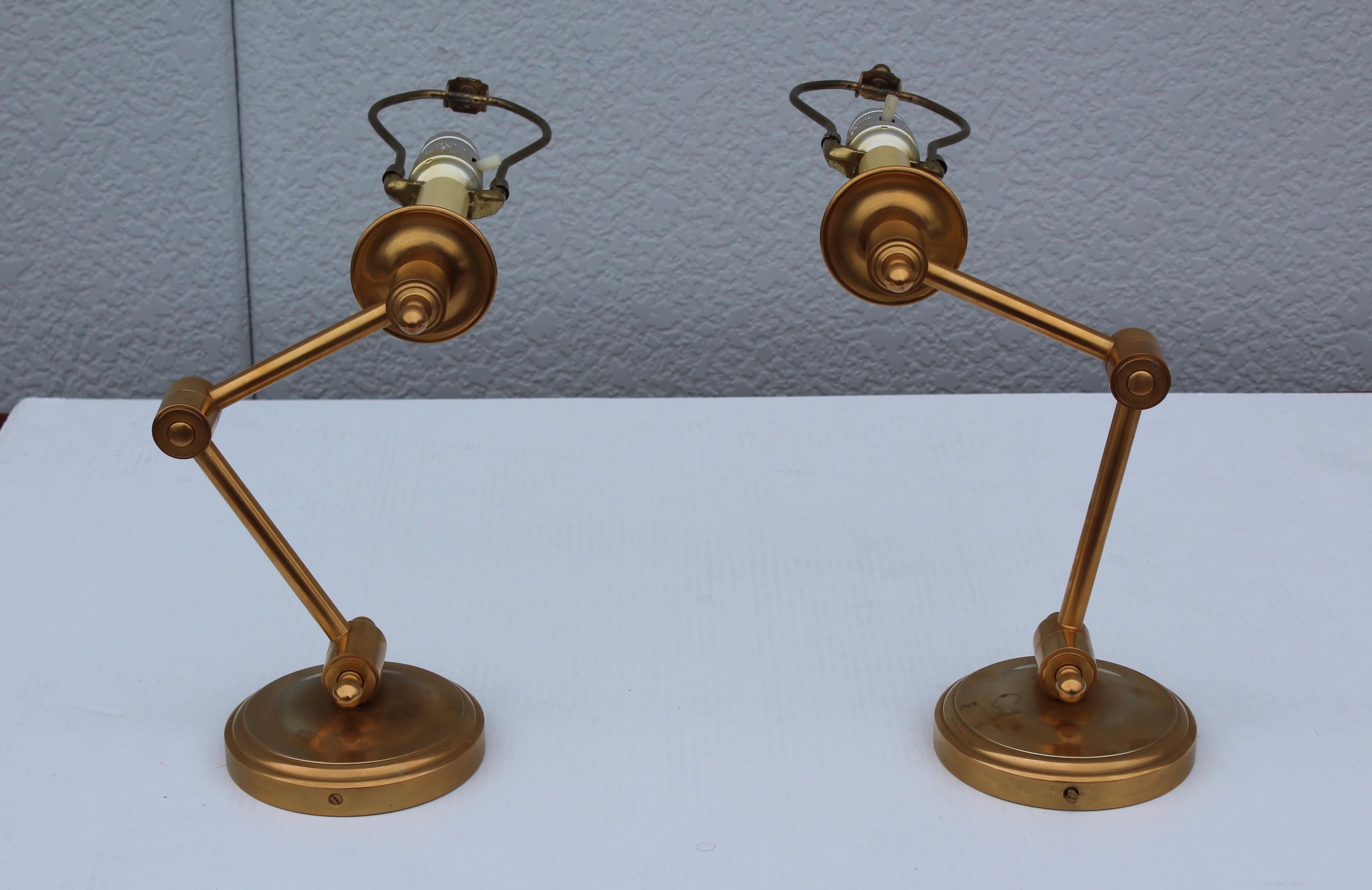 1960s polished brass swing arm brass French sconces.