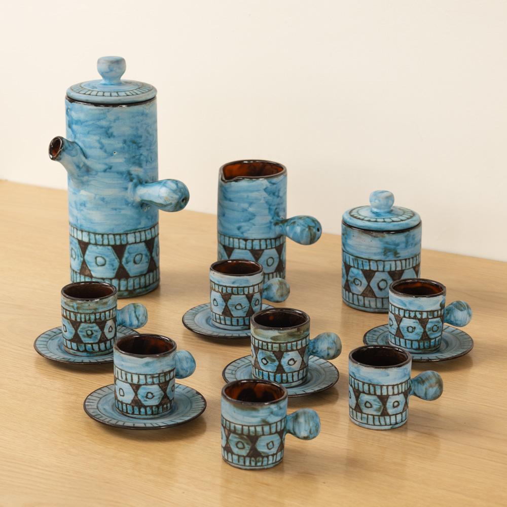 Incredible ceramic coffee set made by French ceramic maker Alain Maunier in Vallauris, 1960's. Set includes 1x large coffee pot with lid, 1x sugar bowl with lid, 1x creamer pot without lid, and 8x espresso cups with 5x saucers. Made in ceramic and