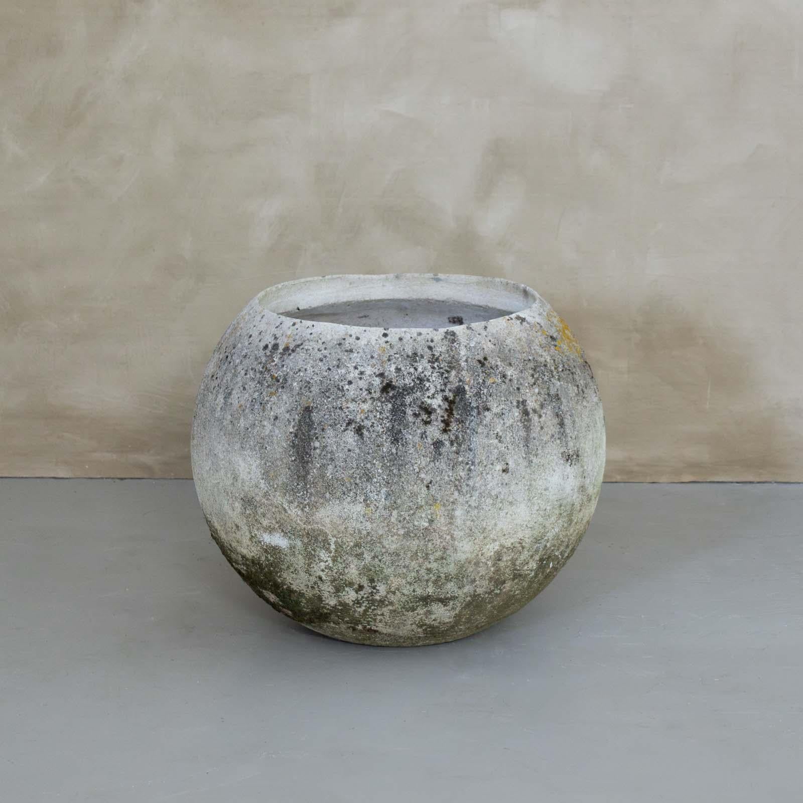Incredible cast concrete ball planters made in France, 1960's. Vintage piece with great modern form in the style of Willy Guhl, perfect for indoor or outdoor use. Wonderful age and patina throughout. Some with moss on exterior. Three sizes available