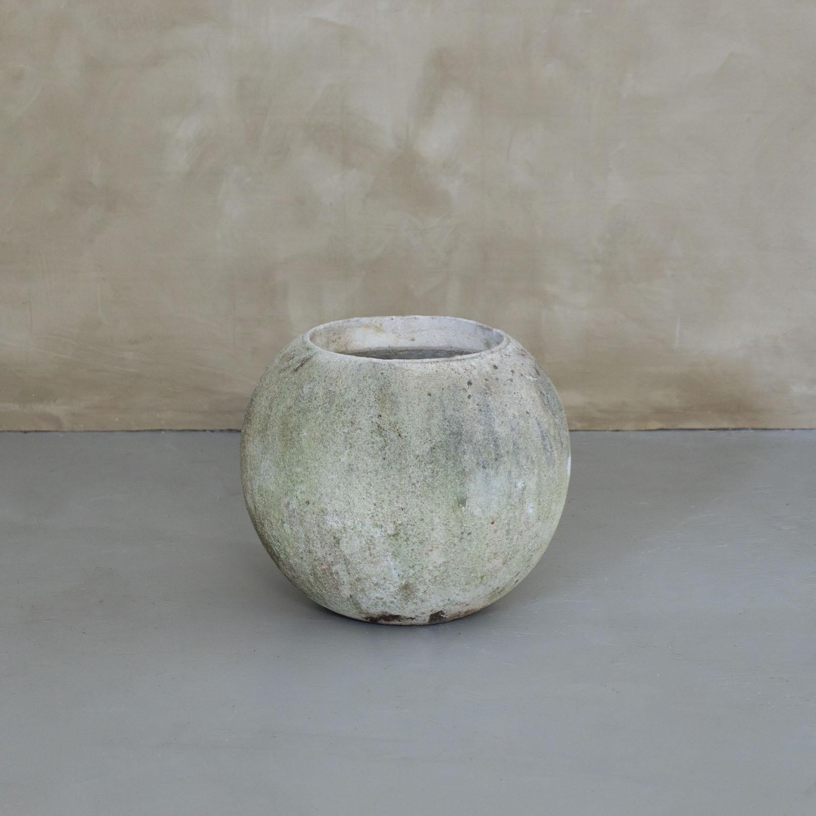 Incredible cast concrete ball planter made in France, 1960's. Vintage piece with great modern form in the style of Willy Guhl, perfect for indoor or outdoor use. Wonderful age and patina throughout. Some with moss on exterior.  Three medium size