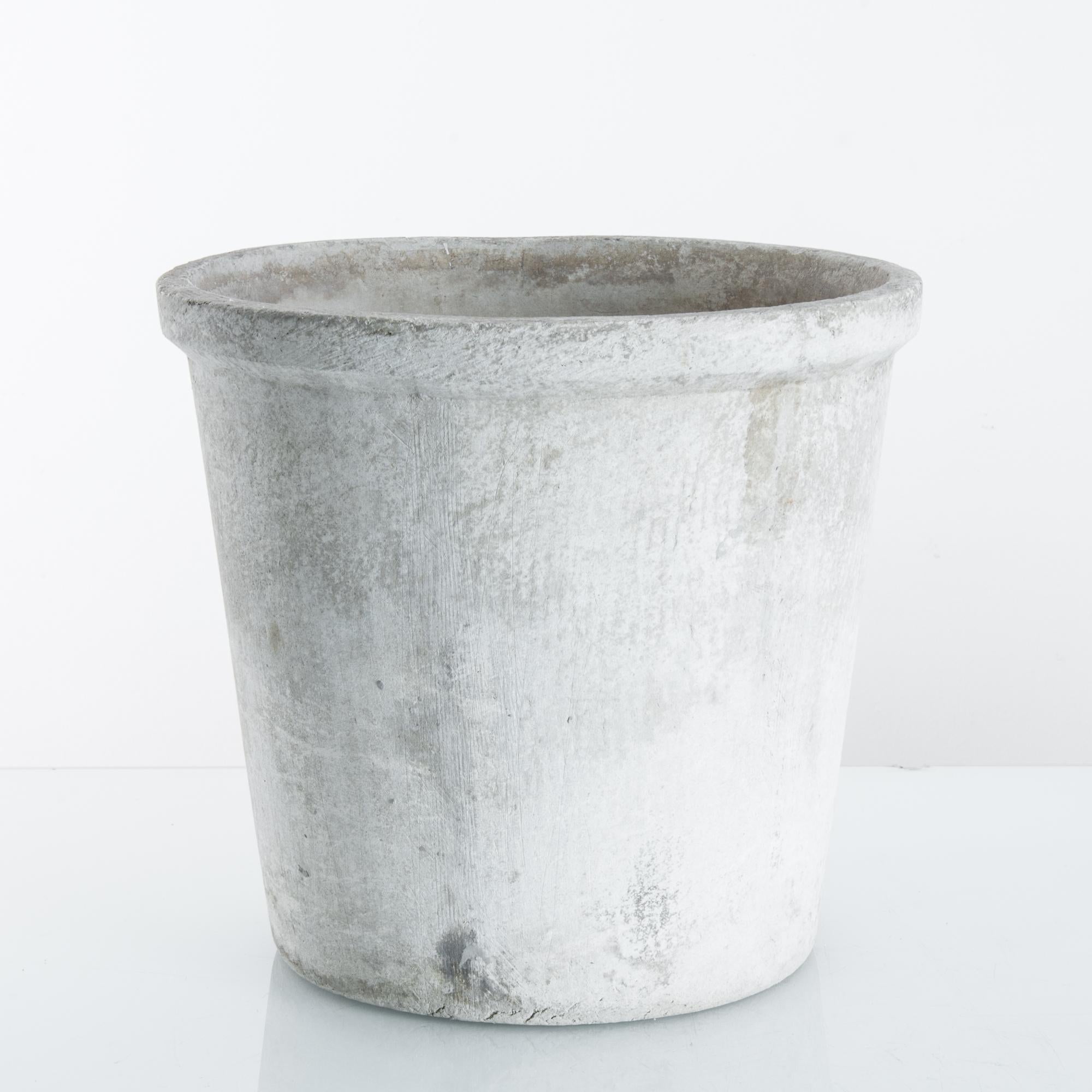A vintage concrete planter from France, produced circa 1960. Design of the mid-century produced forms so timeless they seem obvious to us now — this chic planter being a good example. Simple, modern, and gorgeous, this little planter is ready for