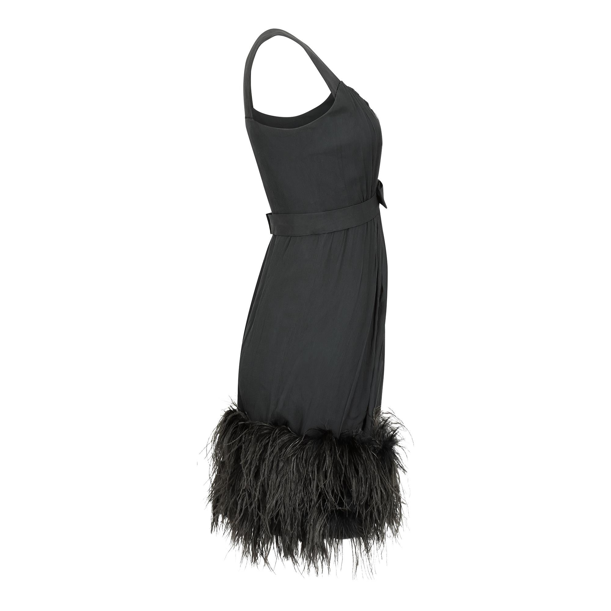This is a superbly executed and original early 1960s French made black silk crepe de chine feather dress. Of detailed construction and quality, sadly the label has been lost but it has clearly been executed to haute couture standards. The dress has