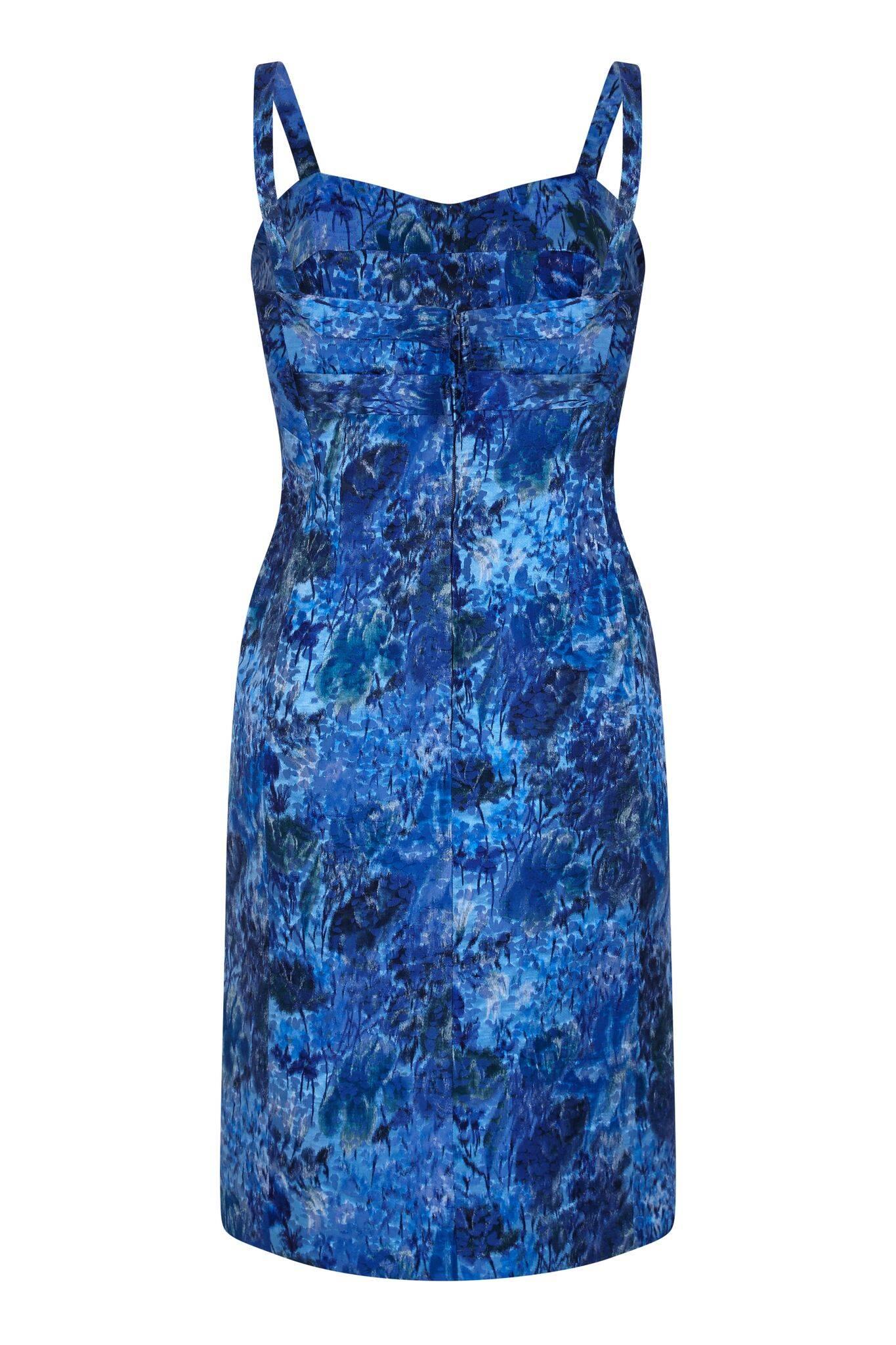 This impeccable piece of 1960s unlabelled French Couture set in textured silk fabric is of exquisite construction. The soft abstracted floral design in cobalt blue, ultramarine, turquoise, navy and forest green is slightly embossed with a mottled