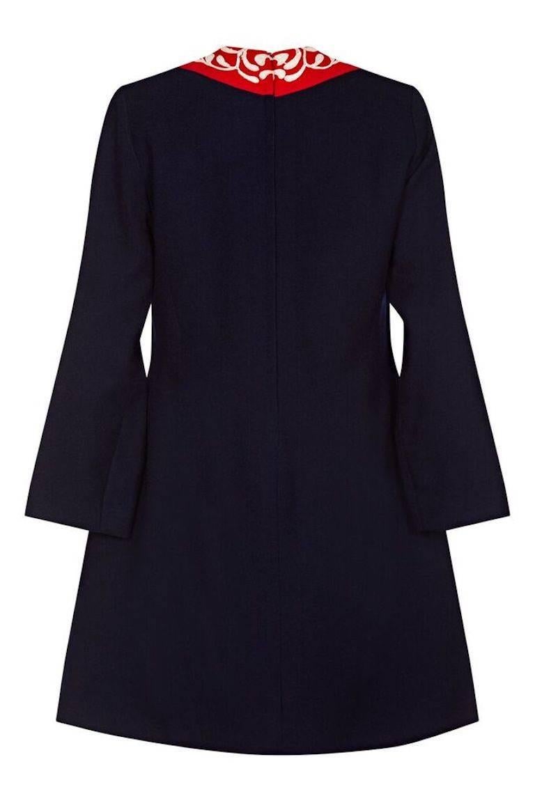 This striking 1960s French couture wool crepe A-line dress in navy blue and pillar box red could be worn day or night to an informal or formal occasion. The simple shift cut is tailored at the breast and waist and finishes just above the knee. It is