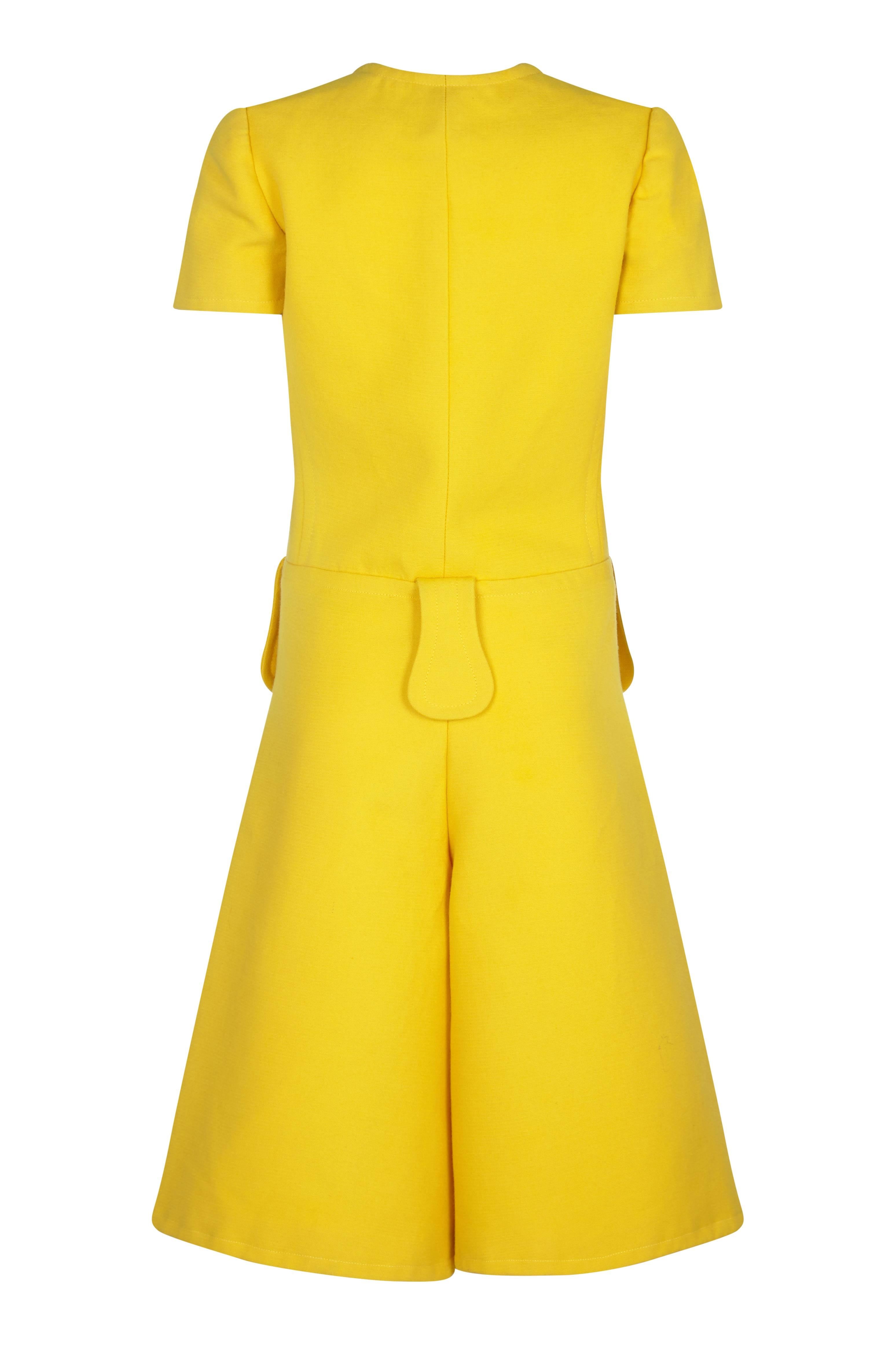 This fantastic 1960s French couture yellow playsuit is in incredible vintage condition and of excellent quality. Sadly the label has been removed from the lining of the dress, and we have priced accordingly in respect of this ambiguity. However, its