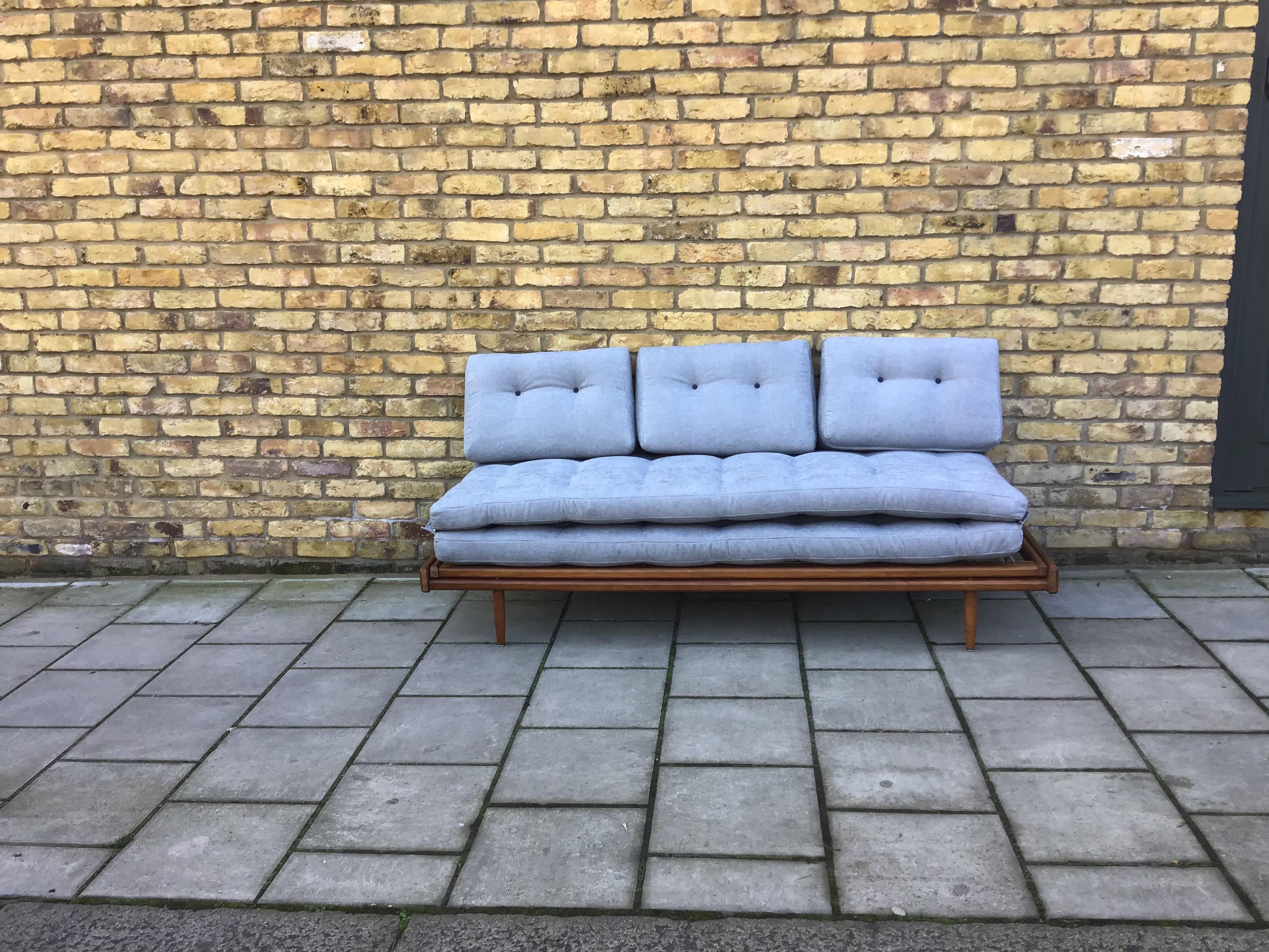 Flexible simple daybed/sofa which easily turns from a sofa into a very comfortable
double bed. With light movement of two bases, re-upholstered light blue cushions
Make for a stunning rare piece, circa 1960s by Georges Tigien, France.