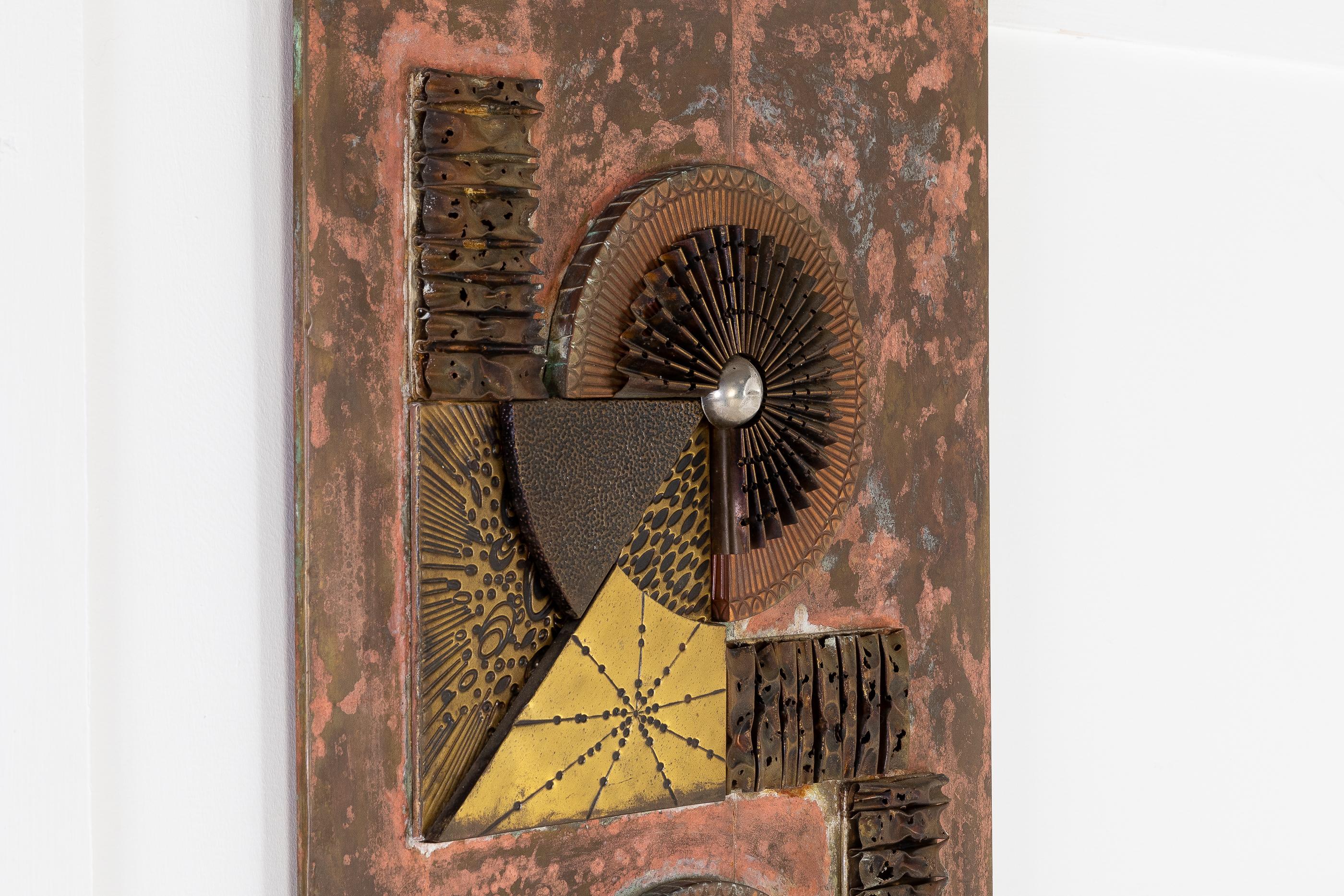 A unique 1960s French decorative metal wall panel made of brass and copper moulded into geometric forms. A nice example of decorative wall sculpture from the sixties.