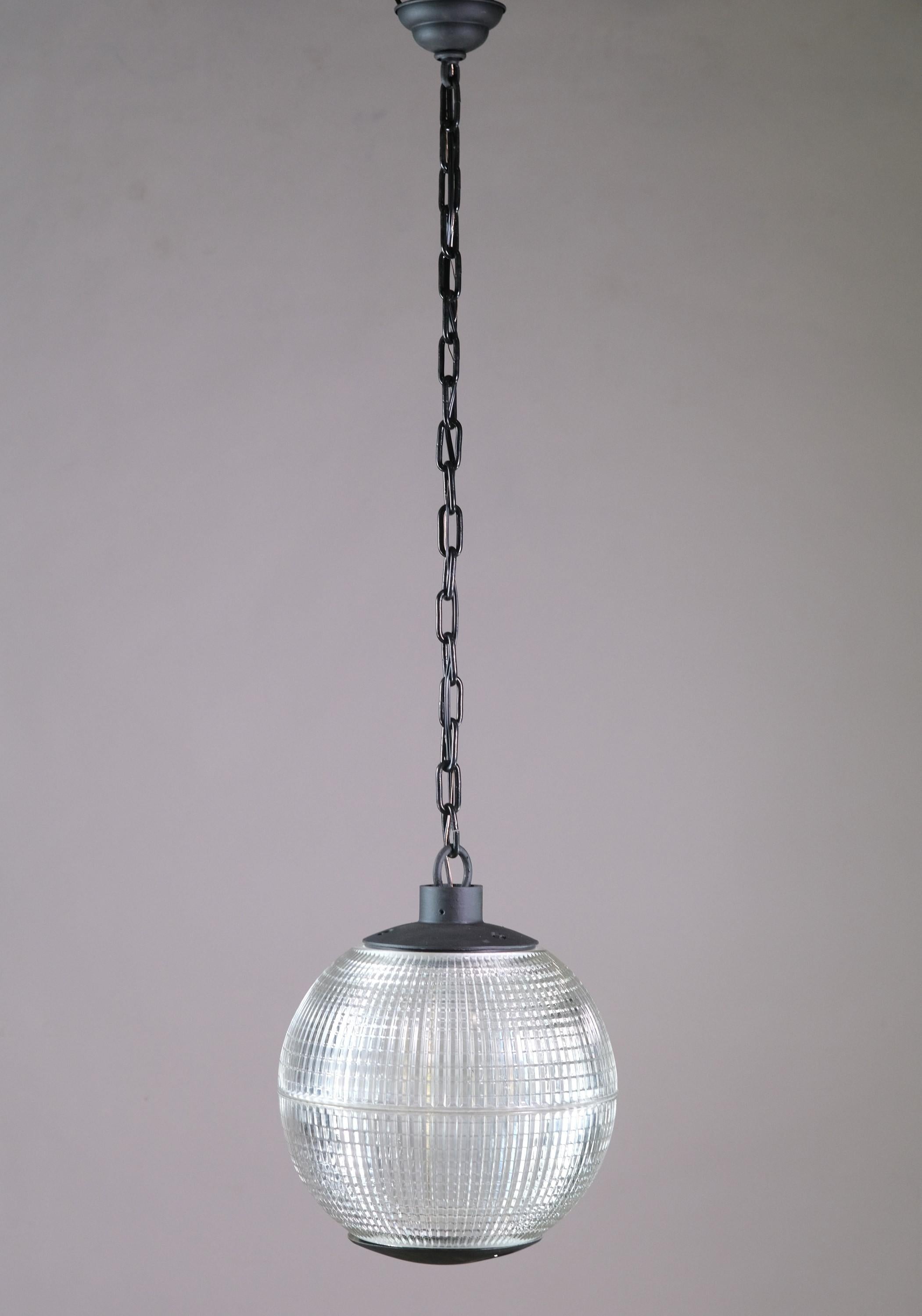 1960s French streetlights from the Normandy Province. Made with the original borosilicate glass shade. Cleaned and rewired to US standards with new chain and hardware. The price includes cleaning and wiring. Measure: 16 in. Small quantity available