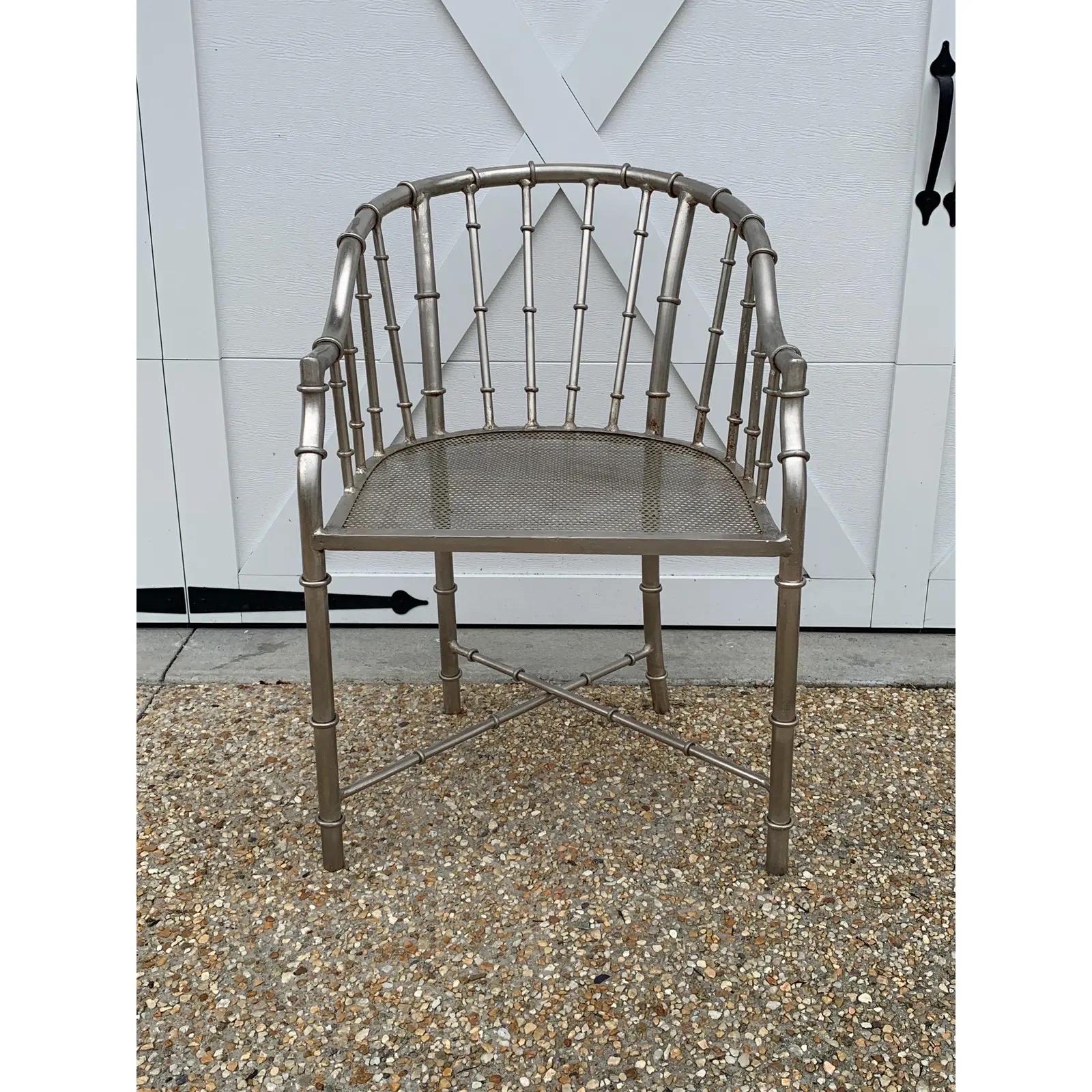 Listed is a stunning, pair of 1960s French steel faux-bamboo armchairs, attributed to Jacques Adnet. The pair are of incredible quality and weight. We suggest the pair be professionally painted or powder-coated for long-term outdoor use. 17in seat