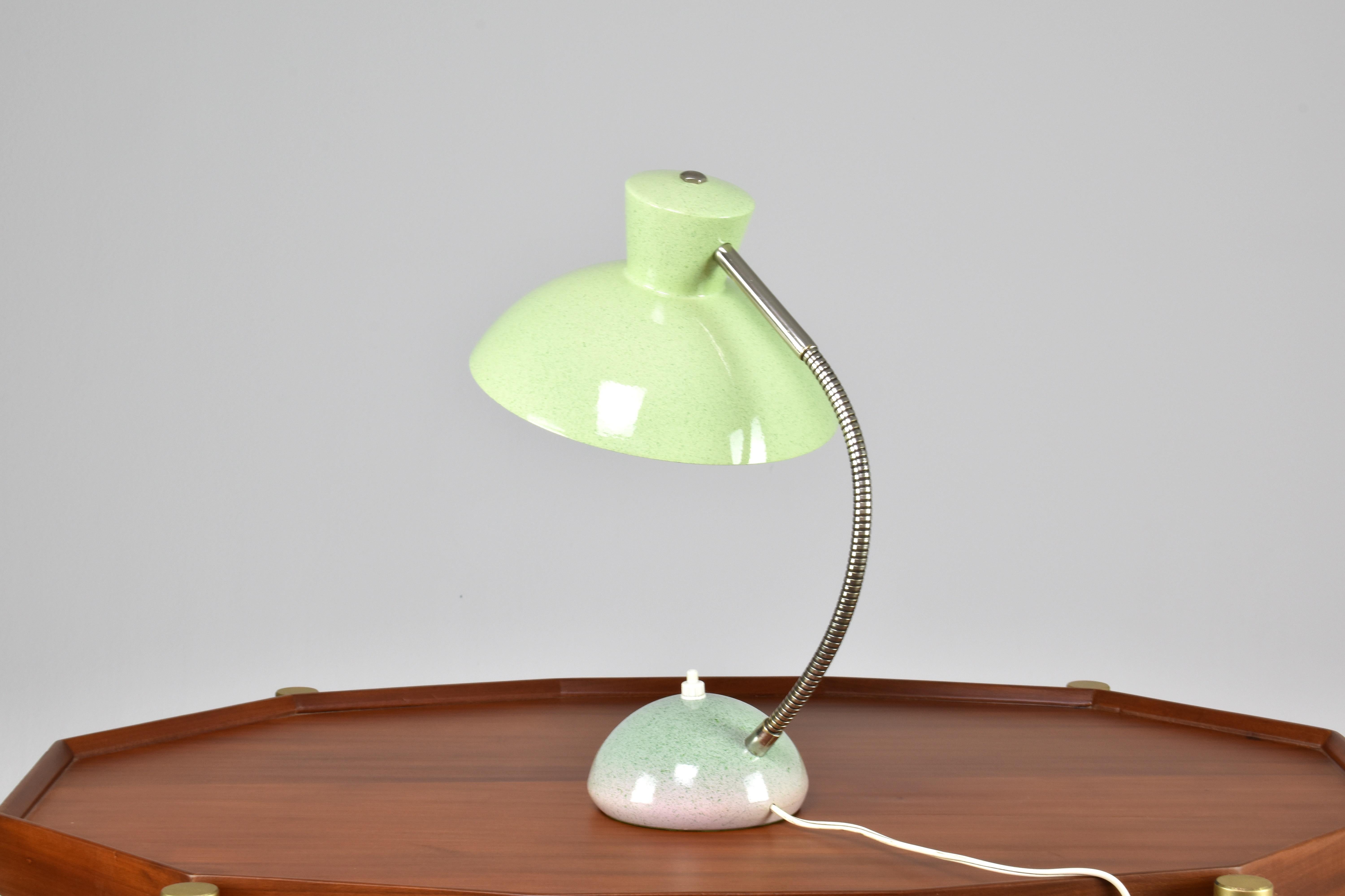 A fantastic mid-century vintage green articulating desk light designed with a quality steel circular base and an aluminium shade. The base features a push-type switch and the arm is in steel. 
France. Circa 1960's. 

The wiring is professionally