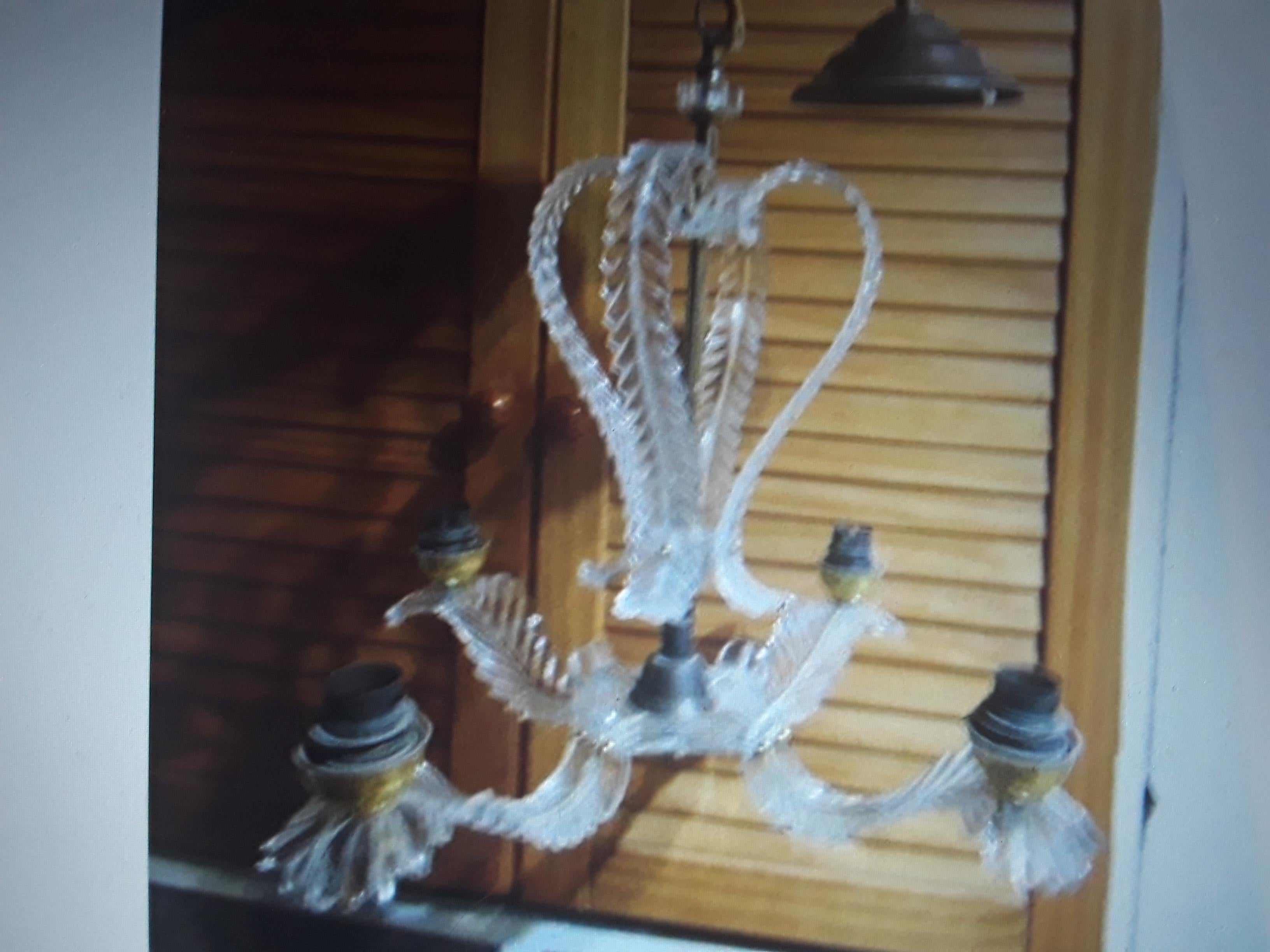 1960's Mid Century Modern Carved Lucite Form Feather/ Plume Chandelier- Lightweight. Beautiful carved detail on the feathers and lights up beautifully.