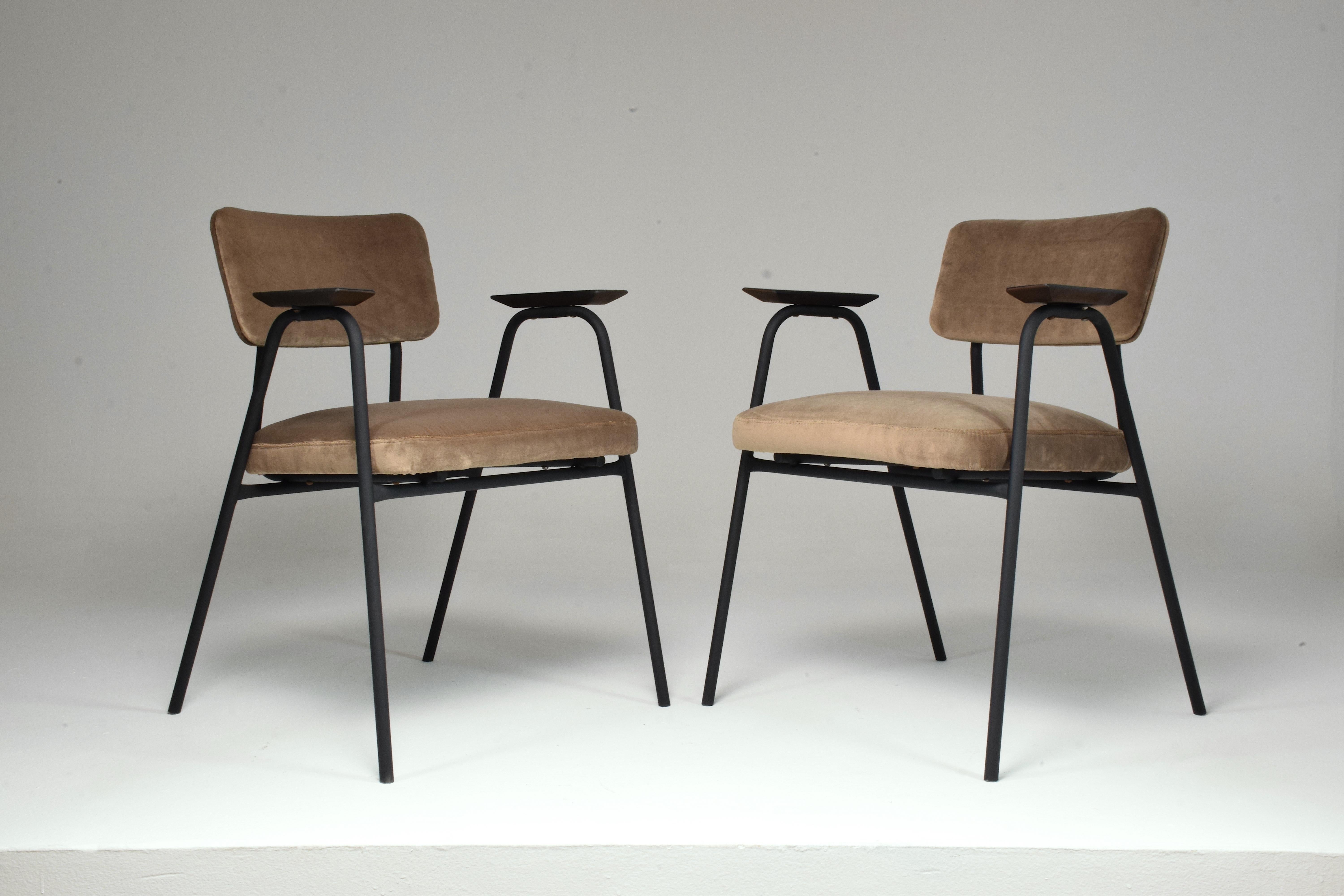 A fantastic set of chairs designed by the iconic Pierre Guariche for Meurop in the 1960's. The organic-shaped tubular structure is made of black matt re-lacquered steel with tinted black oak armrests. Fully restored in a light ash brown velvet