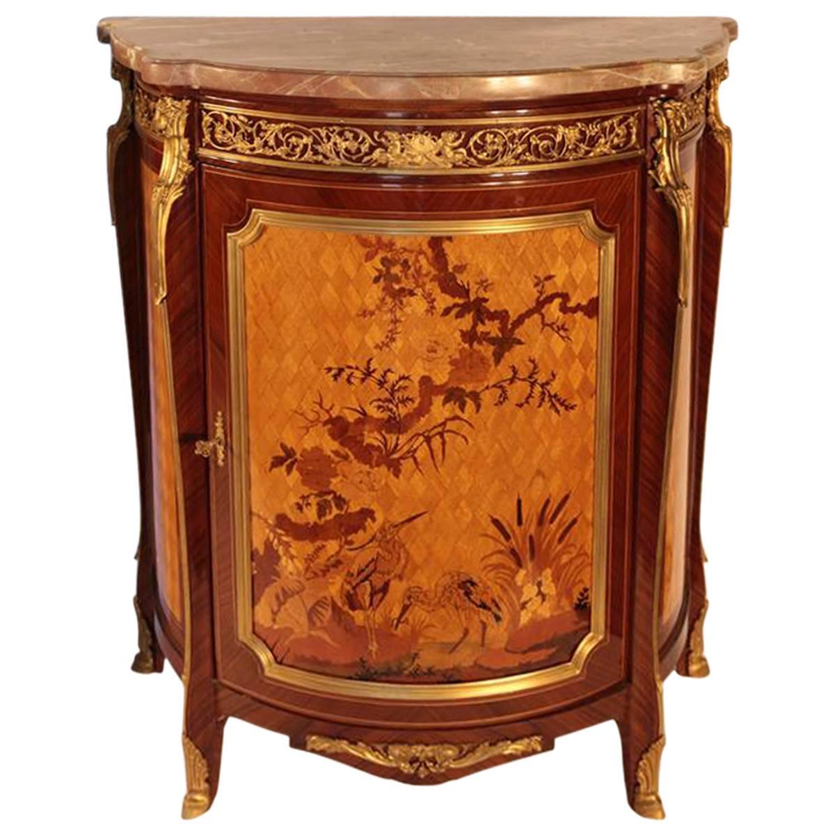 The delicate brass trimmings in an ornate floral motif of these vintage French side tables are reminiscent of an even earlier era. In rich cherry and gold colors, these romantically decorated side tables provide measure: Width 19