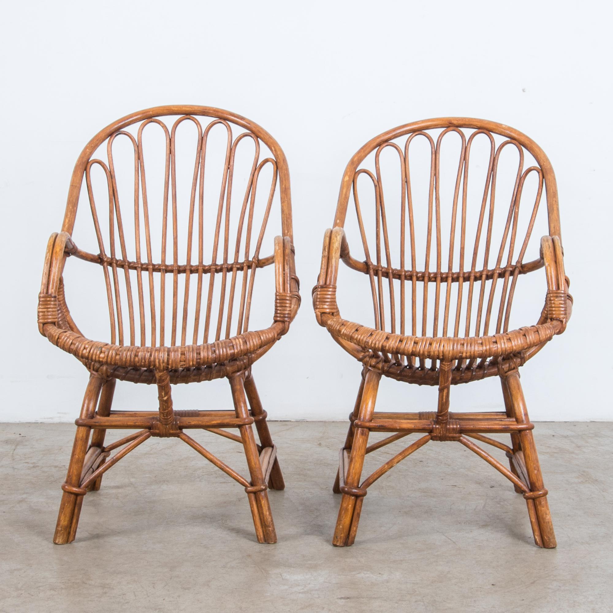 An idyllic memory, warm and comfortably inviting a fresh future. This bamboo and rattan chair set from 1960s, France is framed by a stylish curved seat, reclining comfortably. This unpretentious bamboo chair gives us a wanted moment of relaxation.