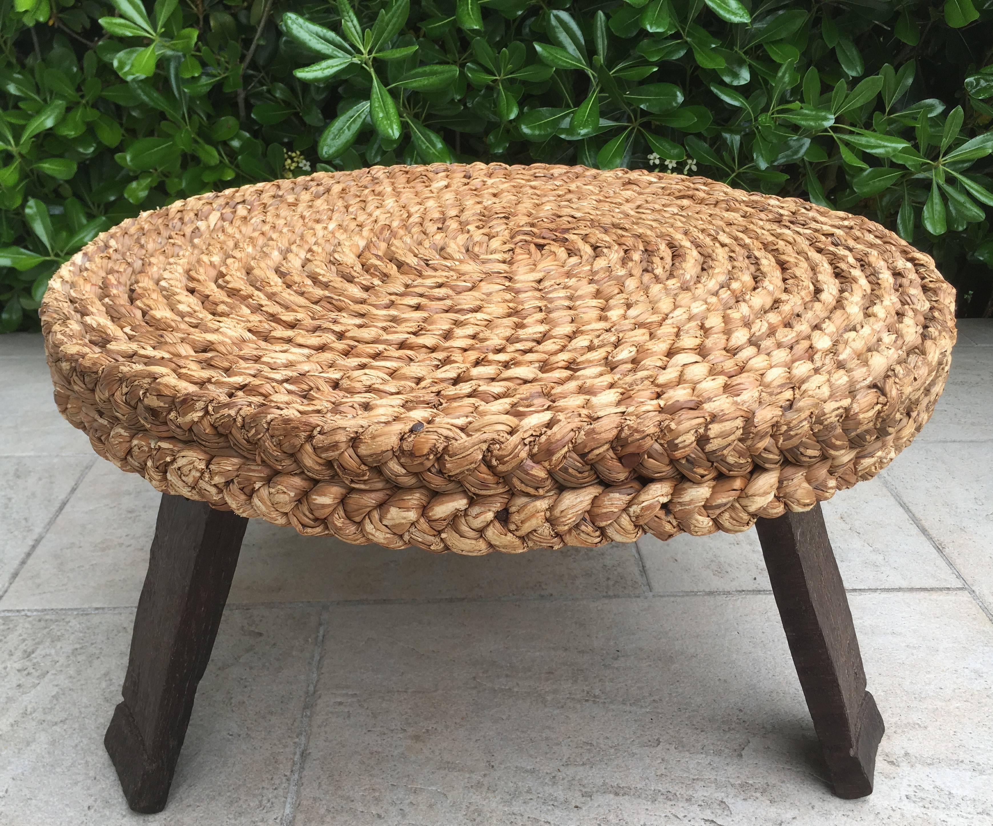 Rare rattan round low table produced in France in 1960s. It comes from a French Riviera house and is attributed to Audoux-Minet
In very good original condition with minor wear to the rattan and minor default to the oak.
A pair of rattan stools based