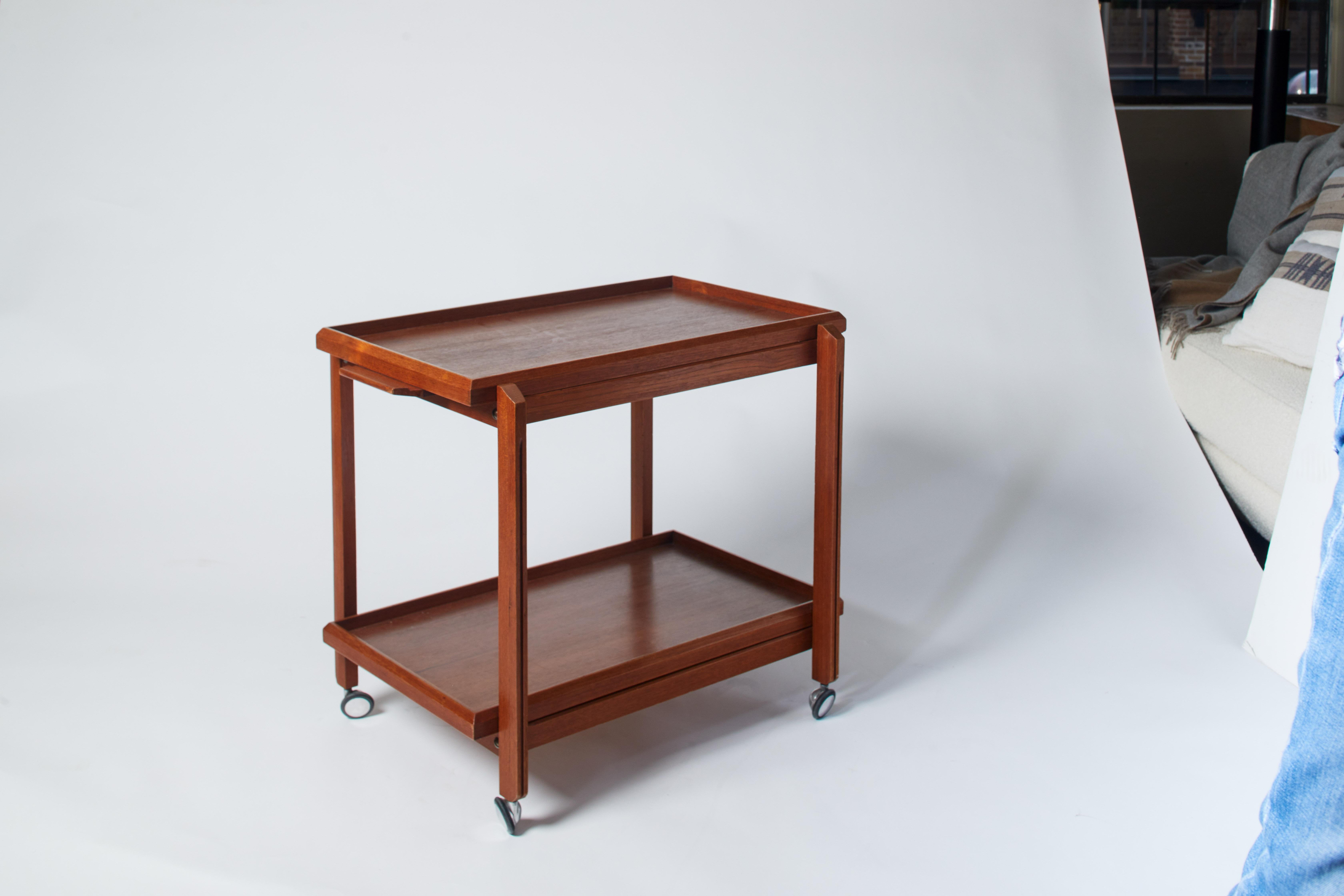 1960s Italian French two-tier oak trolley with removable tray and wheels at base.