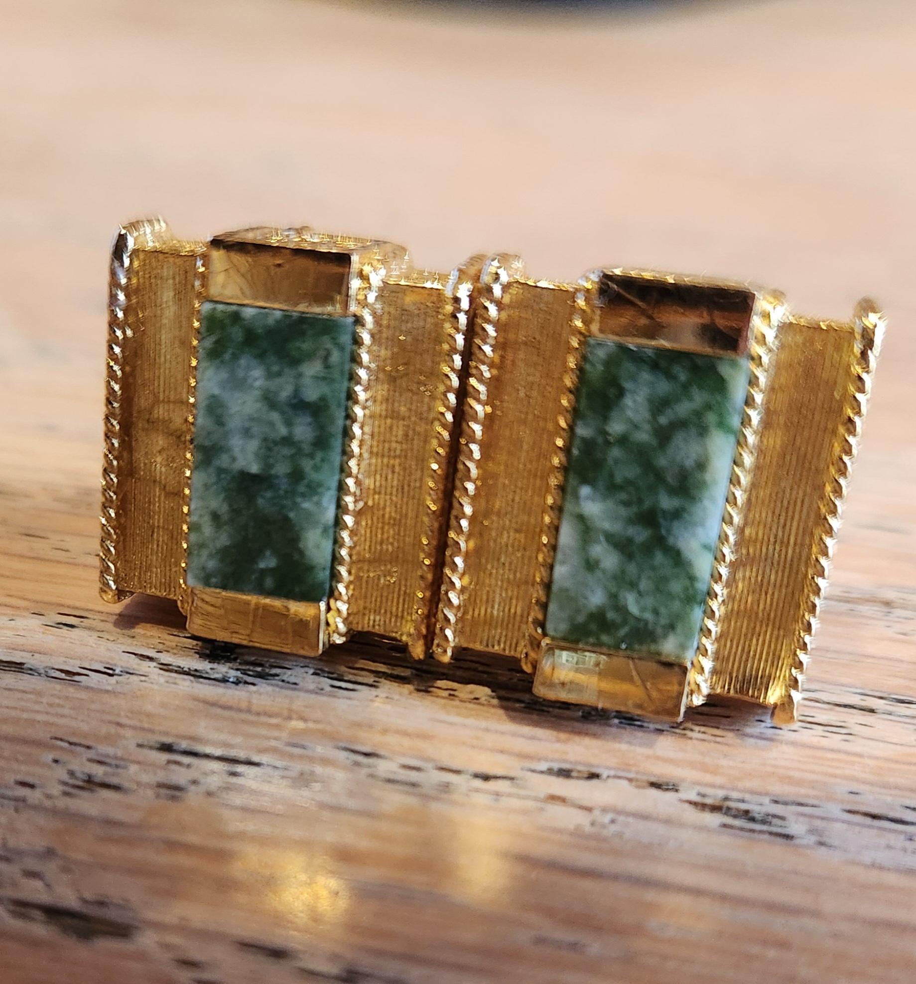 AMBIANIC presents
1960s French Vintage Christian Dior Gold Green Stone Cufflinks
fabulous rich gold tone brutalist design with green jade stone
stamped by maker
.75 x .75 x 1d
Unrestored original preowned vintage.
one cufflink backing ball appears
