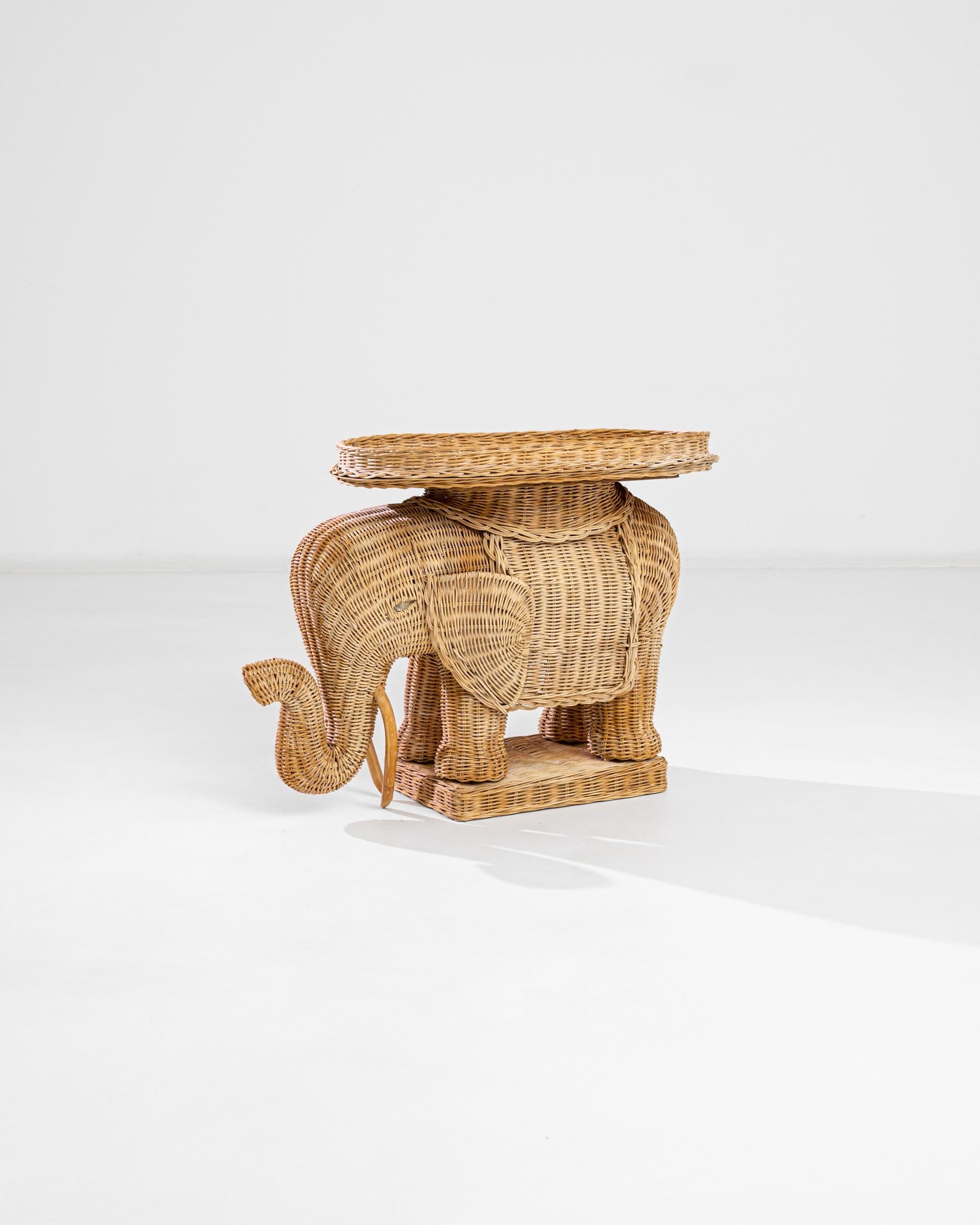 This wicker elephant provides a truly original accent. Made in 1960s France, beautiful craftsmanship is matched only by the imaginative flair of the artisan — the fine weave of the wicker expresses every sinuous curves of the elephant’s form. A