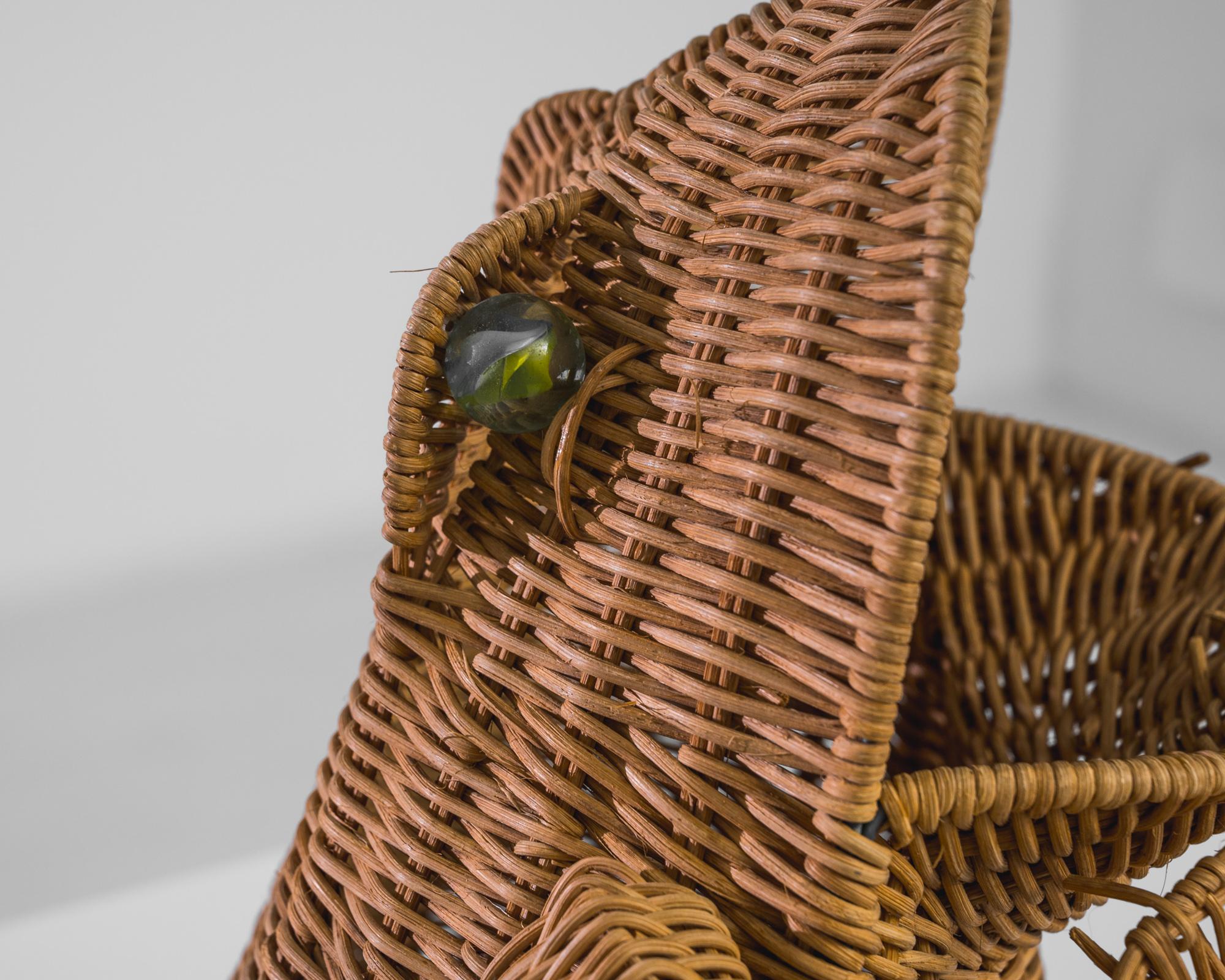 Bring a touch of whimsical charm to your space with this 1960s French Wicker Frog Decoration. Crafted with meticulous attention to detail, this delightful piece captures the playful essence of a frog, featuring a lifelike wicker weave that enhances