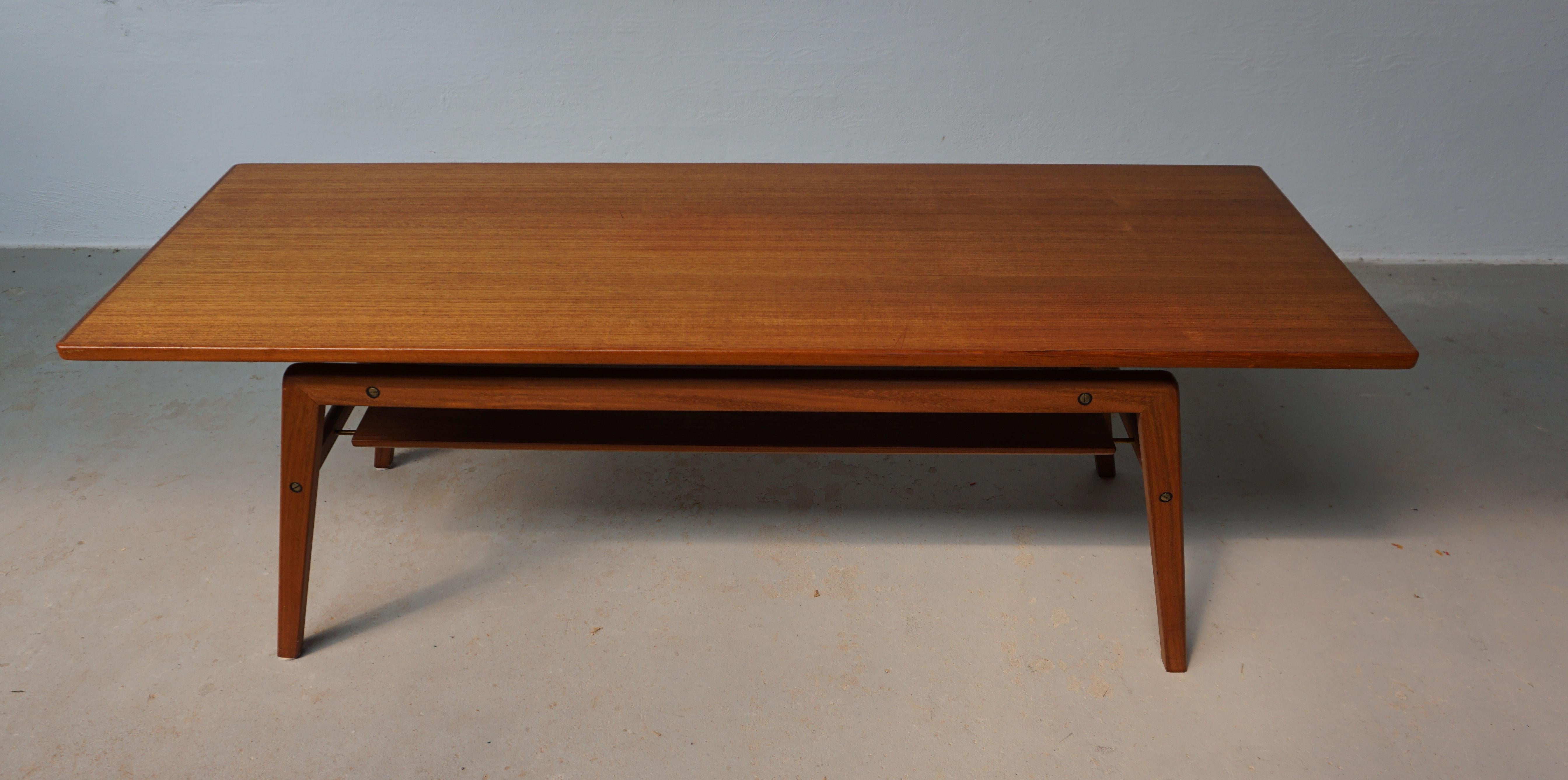 1960s fully restored Danish coffee table in teak attributed to Arne Hovmand-Olsen. 

The well dimensioned coffee table with it´s floating tabletop that makes the whole coffee table look thin and elegant has been fully restored and refinished by our