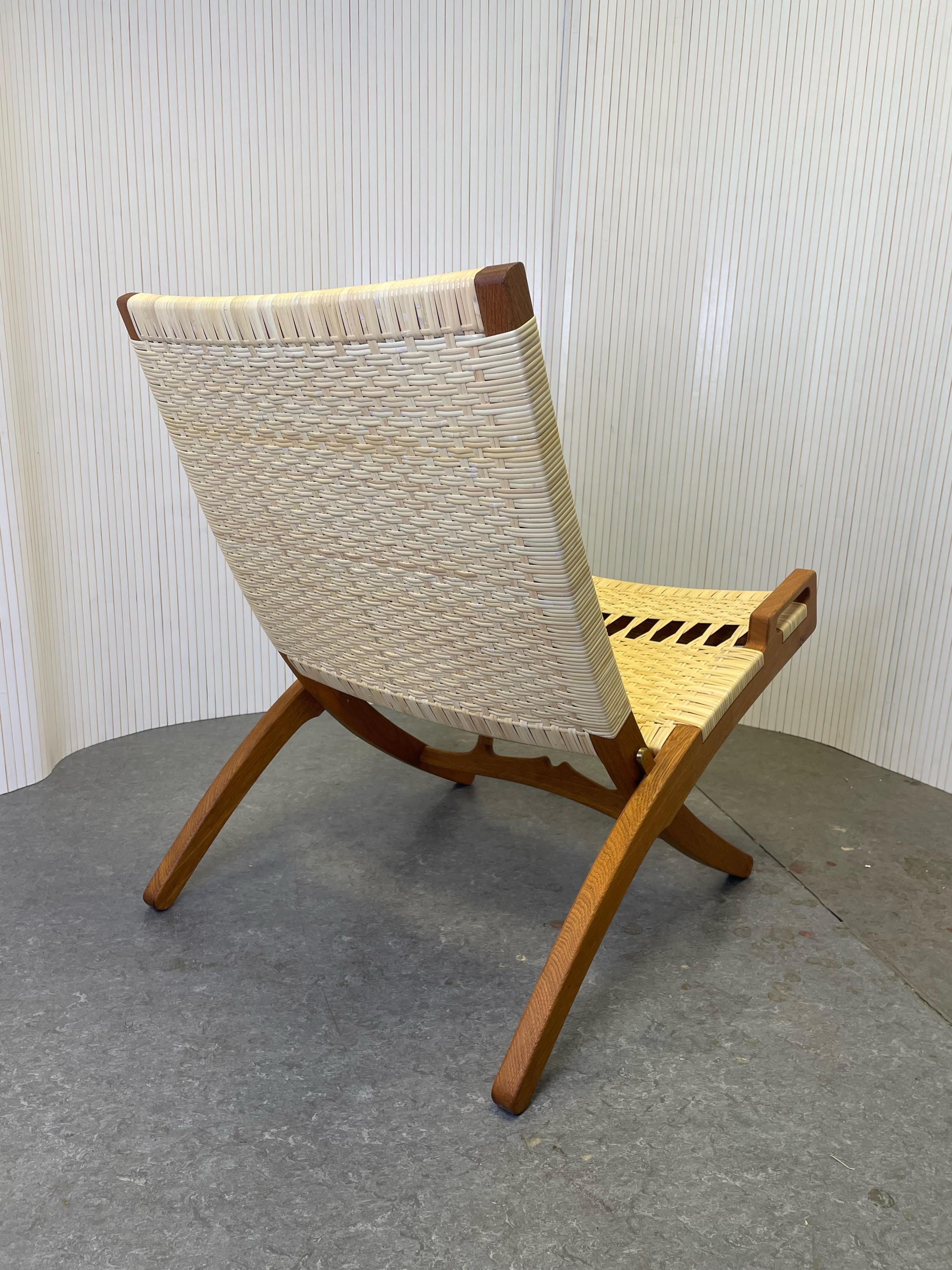 Scandinave moderne Chaise pliante Hans J. Wegner modèle JH 512 des années 1960 entièrement restaurée, rotin et rotin neufs en vente
