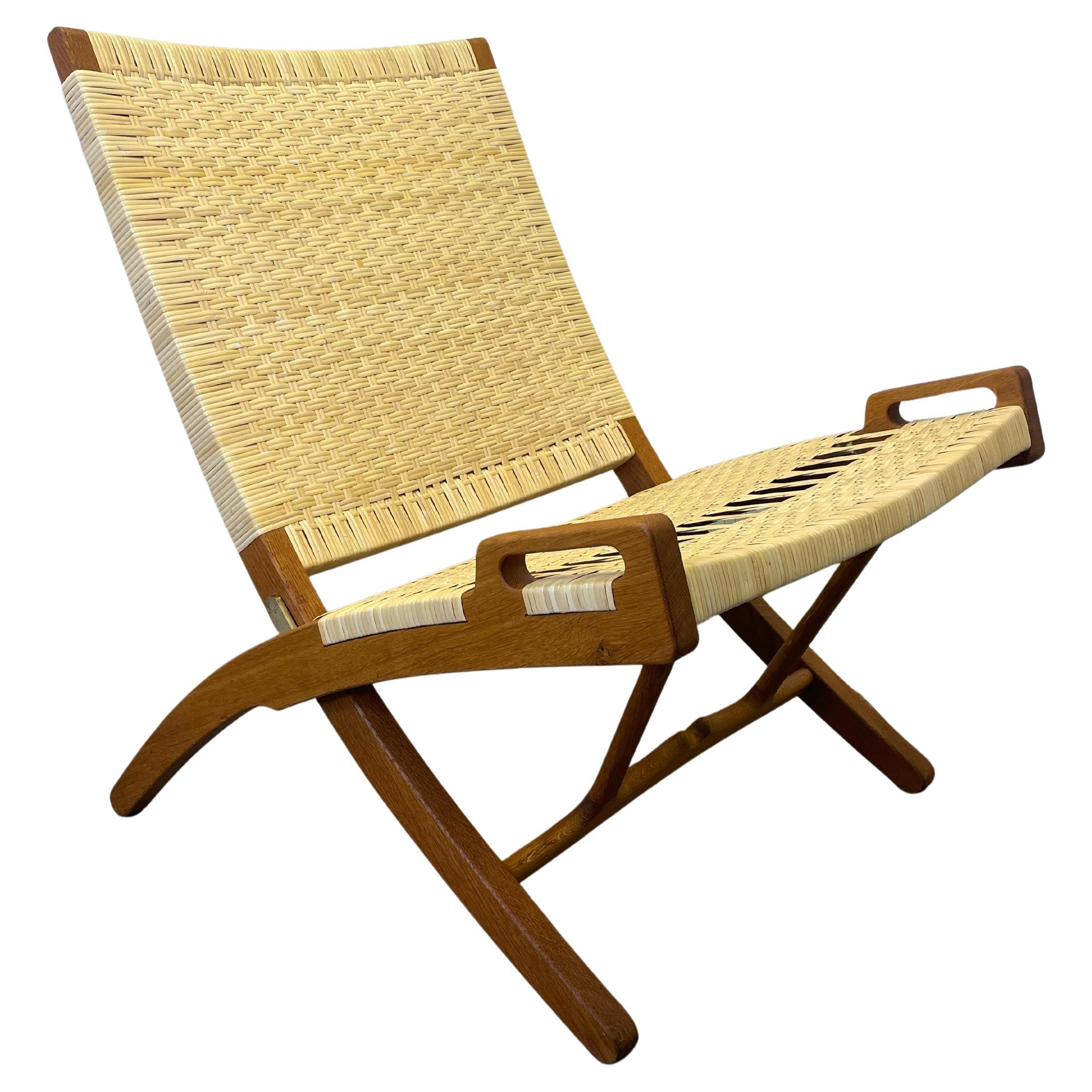 Chaise pliante Hans J. Wegner modèle JH 512 des années 1960 entièrement restaurée, rotin et rotin neufs