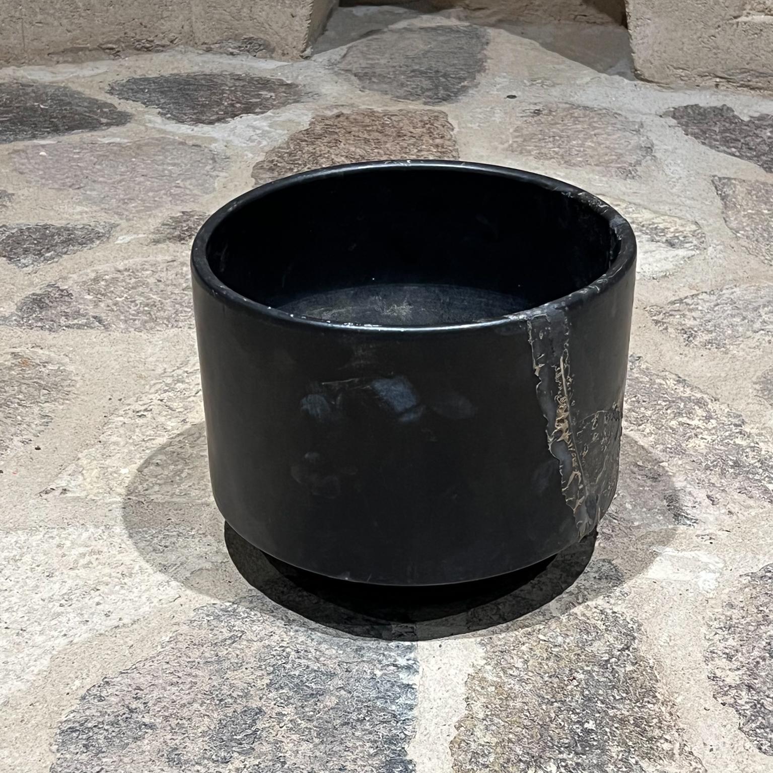 1960s Modern matte black mid-century architectural planter pot.
8 tall x 9.75 diameter.
Black planter garden patio home.
Style of Gainey Pottery. Signed underneath with maker's label.
Original preowned unrestored vintage condition.
See images