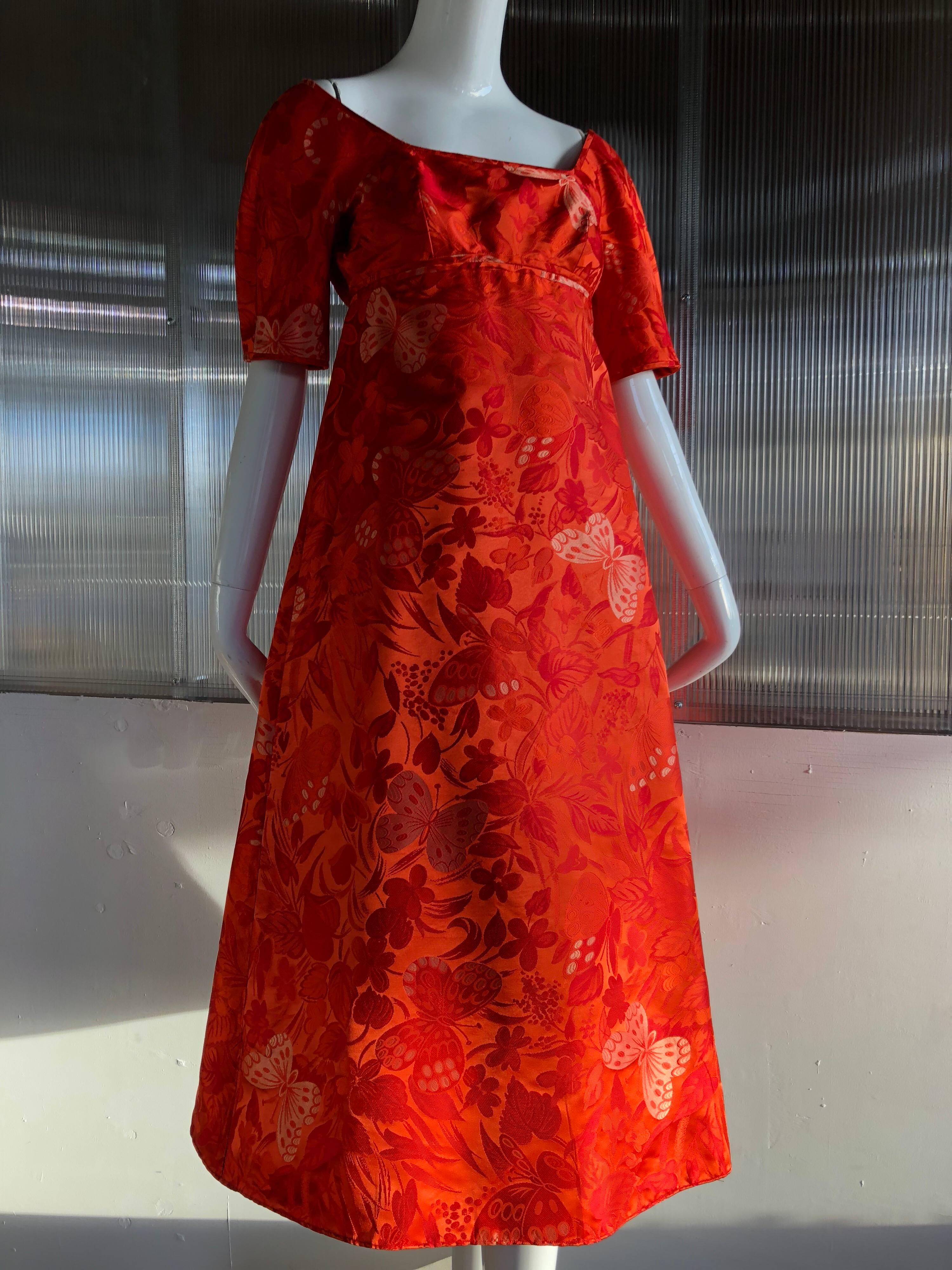 A wonderful 1960s James Galanos lightweight silk brocade butterfly patterned cocktail dress, midi-length, with Empire waist, wide horsehair braid in skirt for volume and fabric ties at back.  
