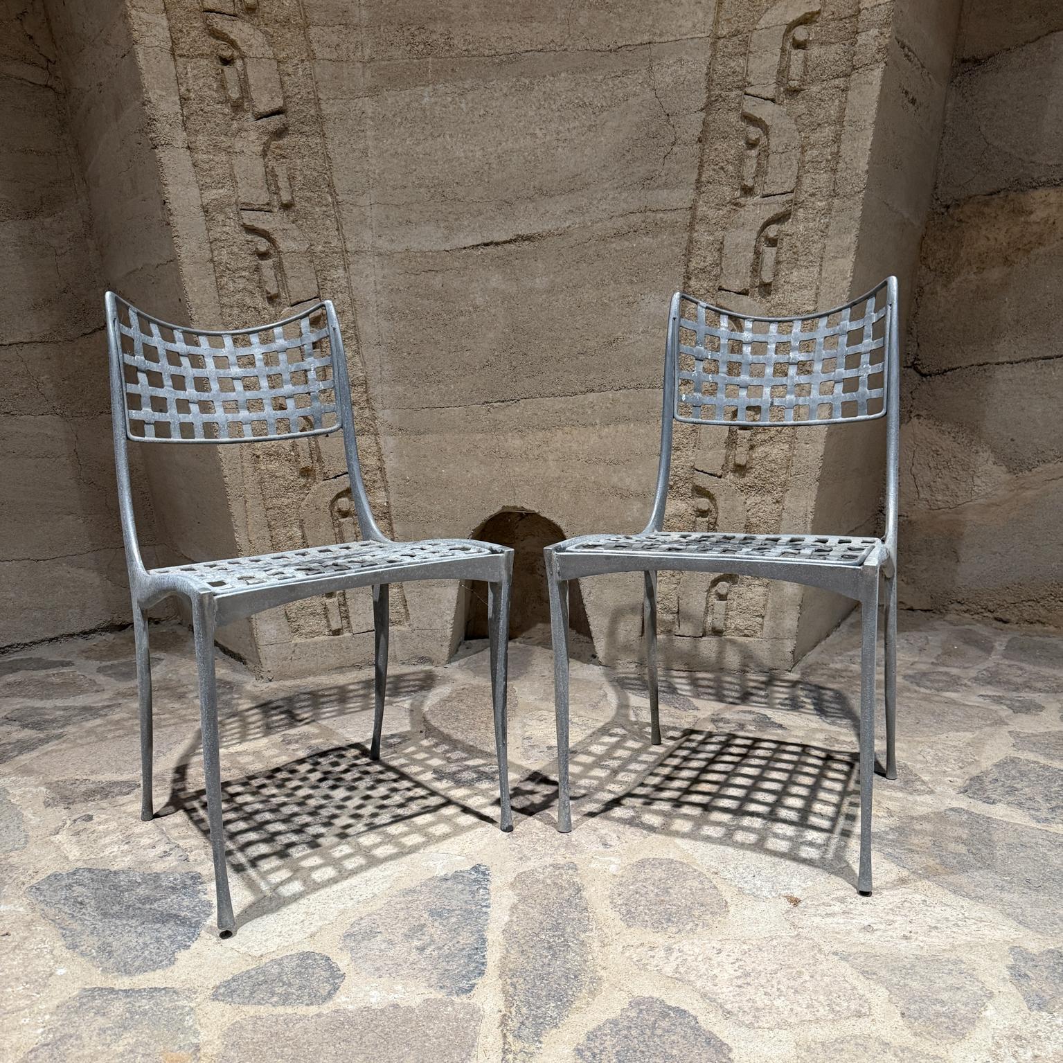 For your consideration a pair of patio chairs designed by Dan Johnson for Brown Jordan, circa the 1960s. Model Sol y Luna Dining Chairs.
Made of Aluminum.
Set  of 2 Gazelle Chairs.
Garden lounge patio dining chairs.
32.75 h x 18.5 w x 21.5 d Seat