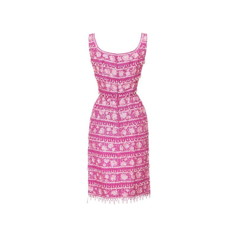 1960’s Gene Shelly pink beaded wiggle dress with beaded tassel details. Floral print design throughout. Scoop neck mini dress.

Additional information:
Marked size US 4, fits size US 2.
Bust: 34