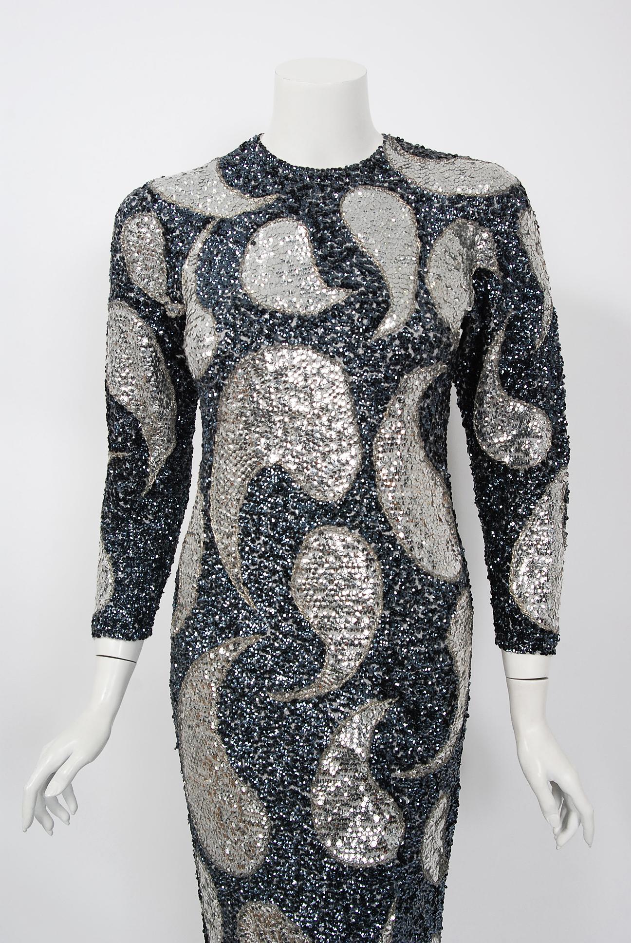 Mid-century Gene Shelly designer garments are in a class of their own. They are always fully-sequined by hand and fit to flatter the figure. This early 1960's treasure has a fantastic graphic paisley design worked in, featuring iridescent-beadwork.