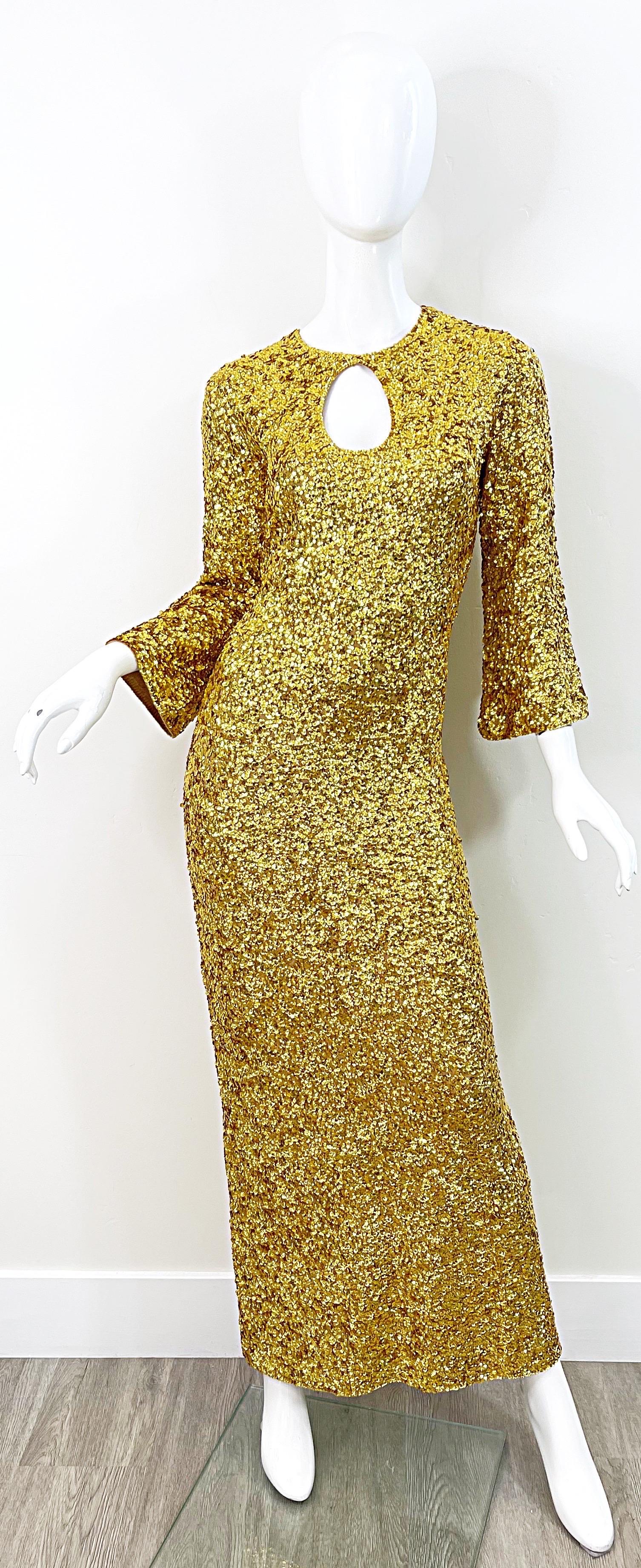 Phenomenal early 60s GENE SHELLY’S International Boutique International gold sequined full length dress ! Features thousands of hand-sewn sequins on a soft stretchy wool. Keyhole opening under center neck. Full metal zipper up the back with