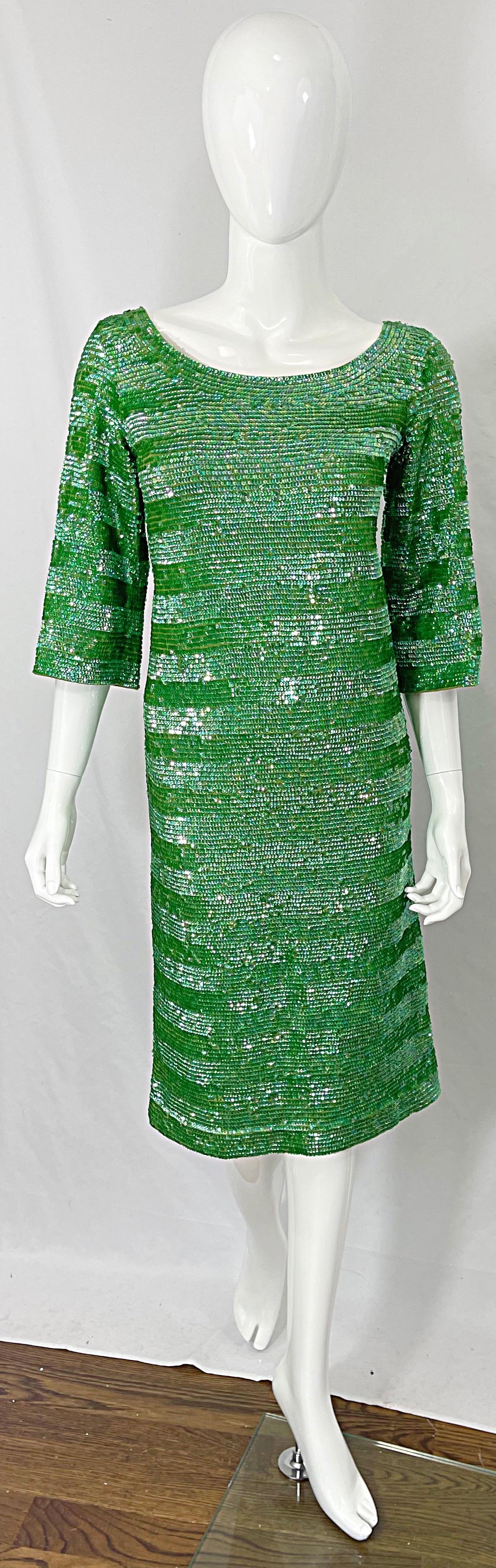 Chic early 60s vintage lime green fully sequined 3/4 sleeves wool dress ! Features thousands of hand-sewn sequins throughout the entire dress. Fully lined in rayon with full metal zipper up the back and hook-and-eye closure. 
Great for any day or