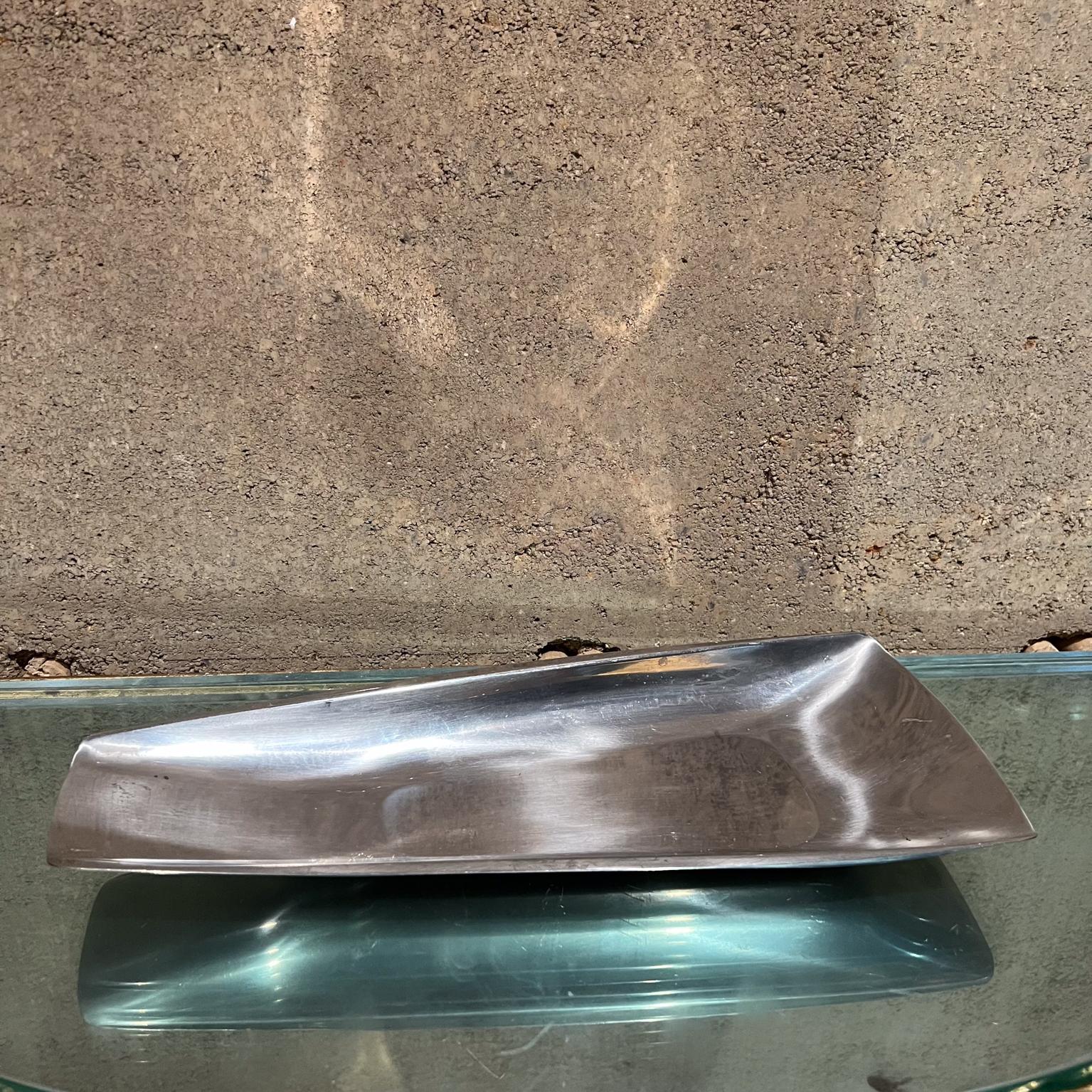 Midcentury Modernist Wedge Serving Tray from Sweden
Stainless Steel
Stamped Gense
13.75 long x 5.5 w x 1 h
Unrestored vintage condition
See all images provided.