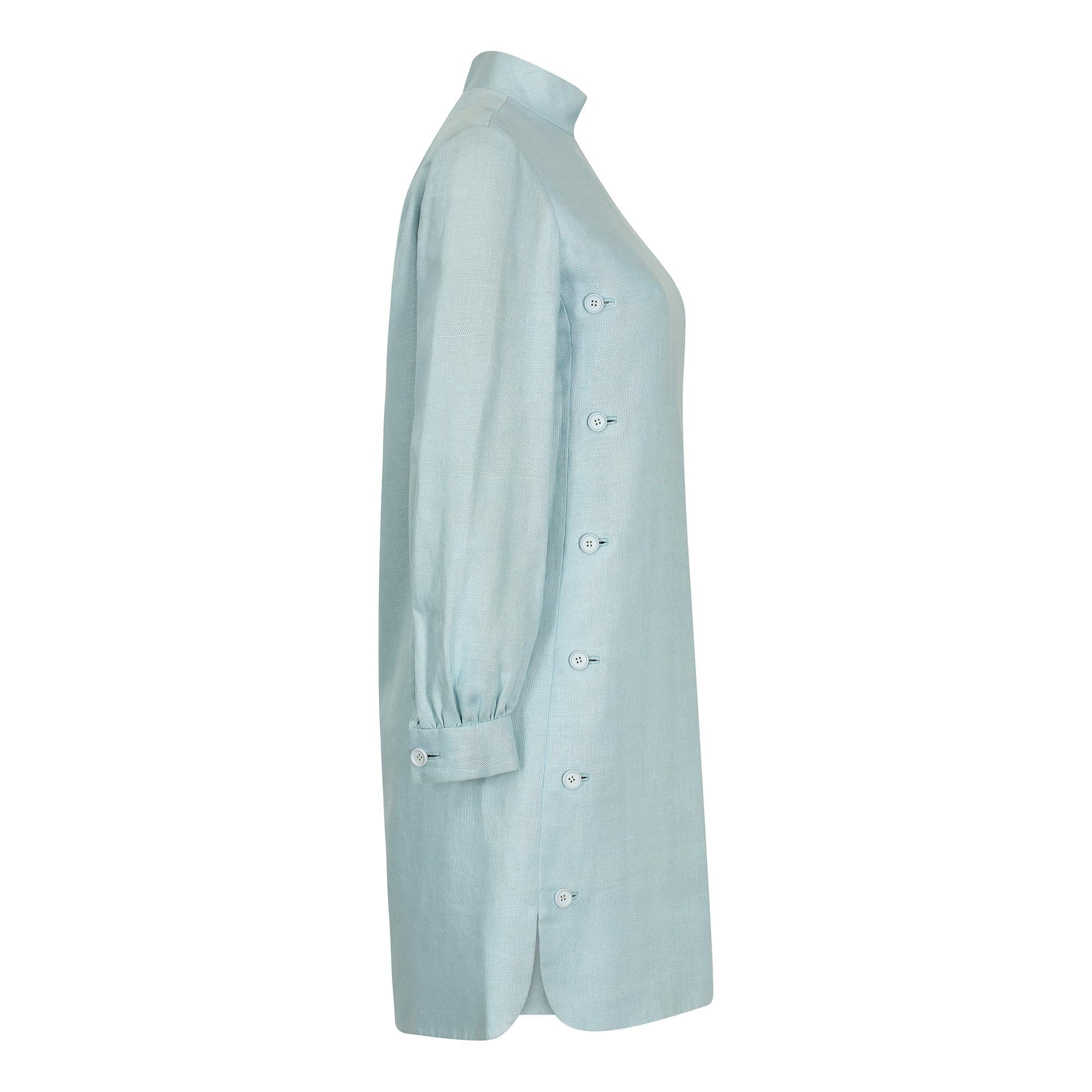 This baby blue 1960s Mod style dress is by the New York designer Geoffrey Beene; celebrated for his craftsmanship, attention to detail and relaxed wearable designs. This classic 60s piece marries two design elements in the tunic-like appearance of