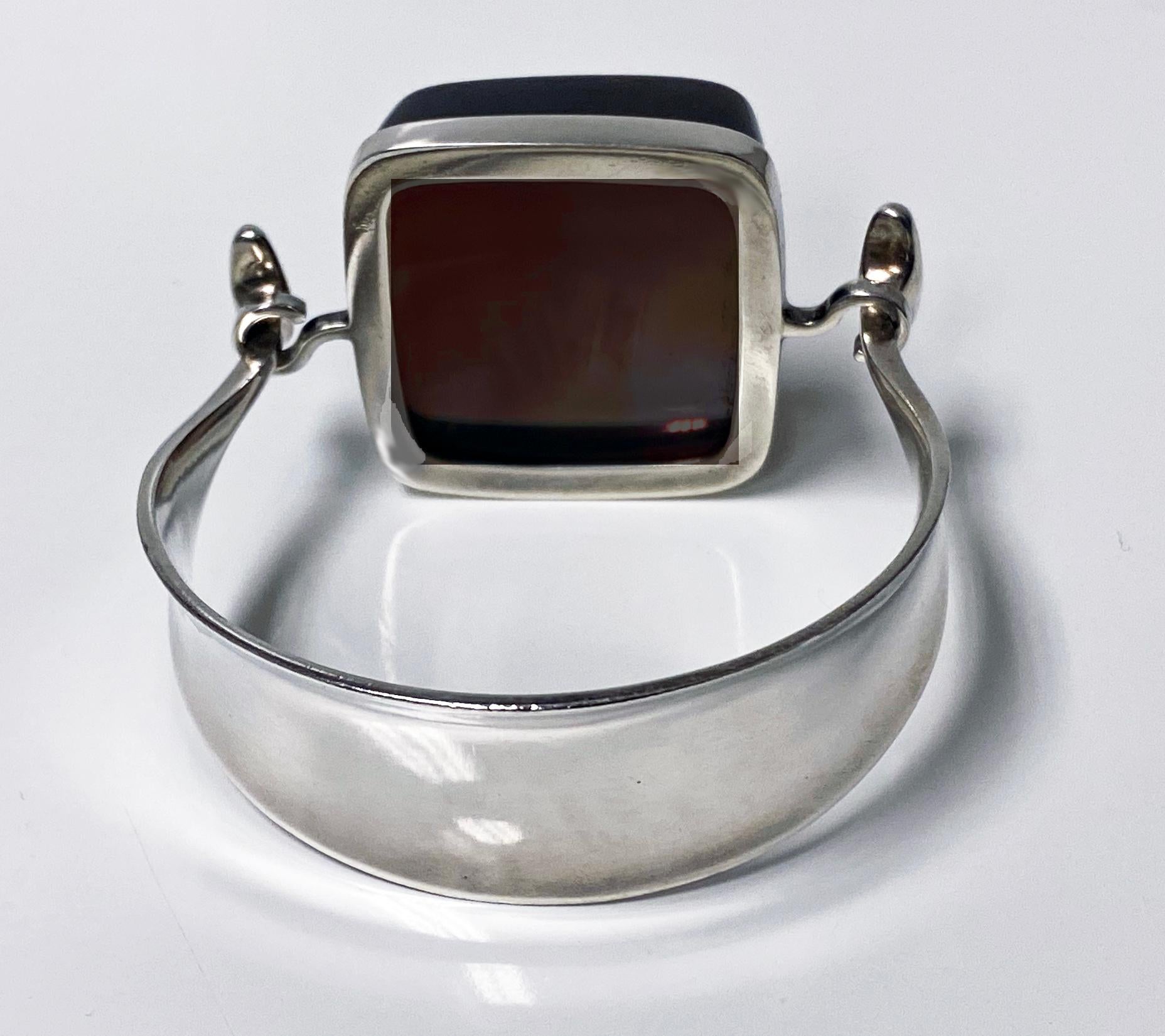 Georg Jensen Bangle topaz colour rock crystal model # 203B Designed by Vivianna Torun Bülow-Hübe C. 1969. Sterling Silver extremely rare design. Fits wrists up to 7 inches, tension clamp opening. Approximate dimensions: bangle circumference inside: