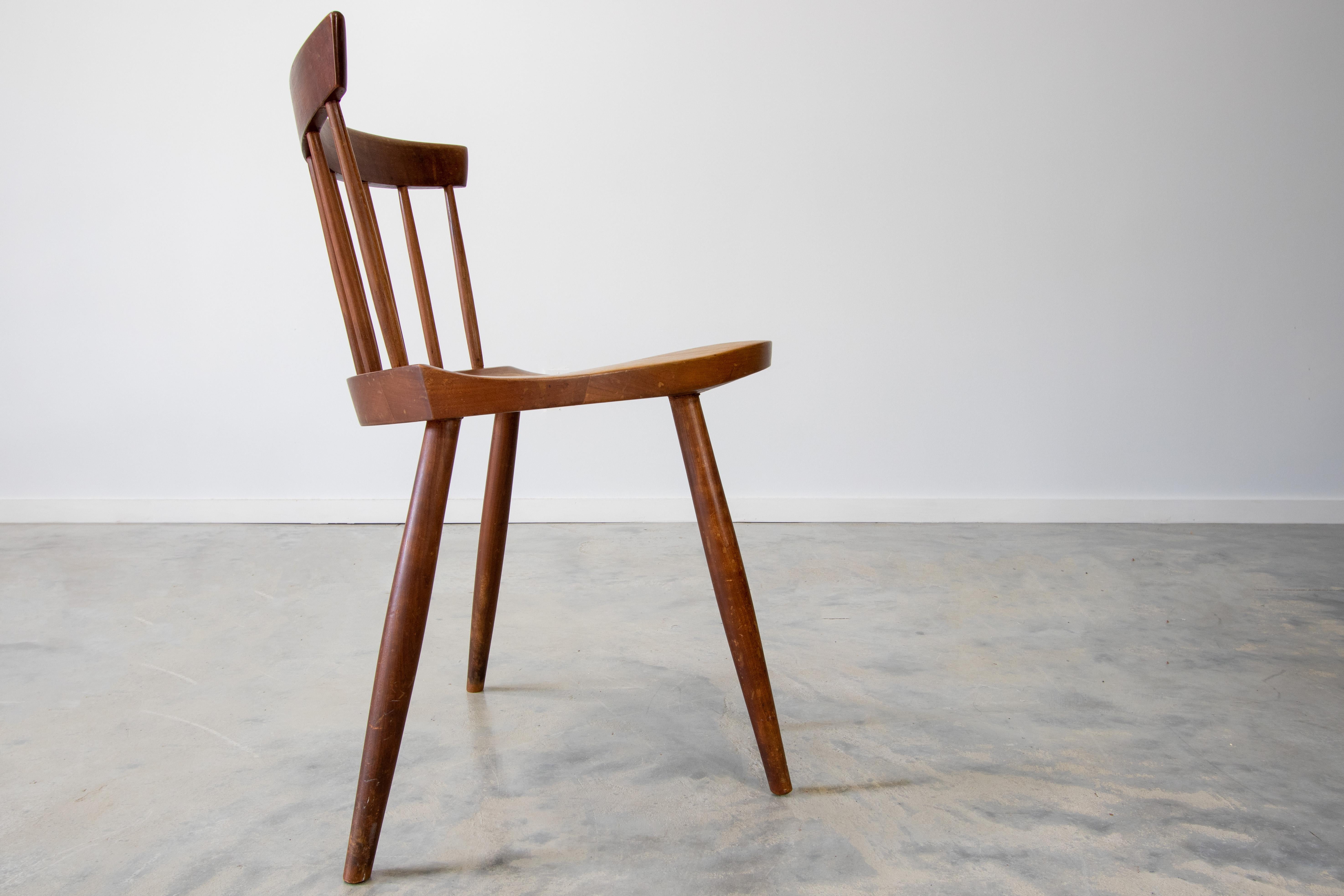 A solid cherry Mira chair in the manner of George Nakashima Studios. This chair came from a NJ estate loaded with Nakashima pieces. This one stood out to us, as the Mira side Chair designed by George Nakashima was never offered with four legs.