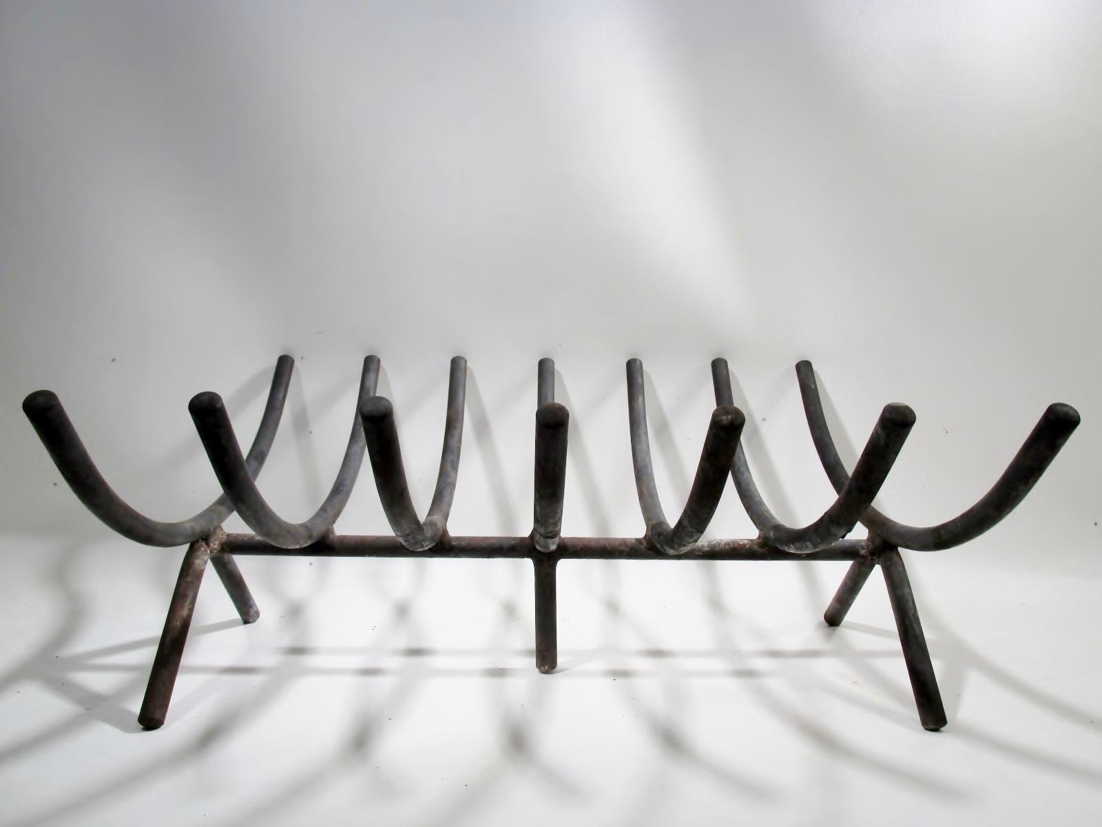 A classic original 1960s Howard Miller fireplace “Firebasket” log fire holder designed by George Nelson Assoc. Overall approx. 20” long, 18” deep, and 9” tall of forged iron.

Condition is very good overall showing patina from age and use, no