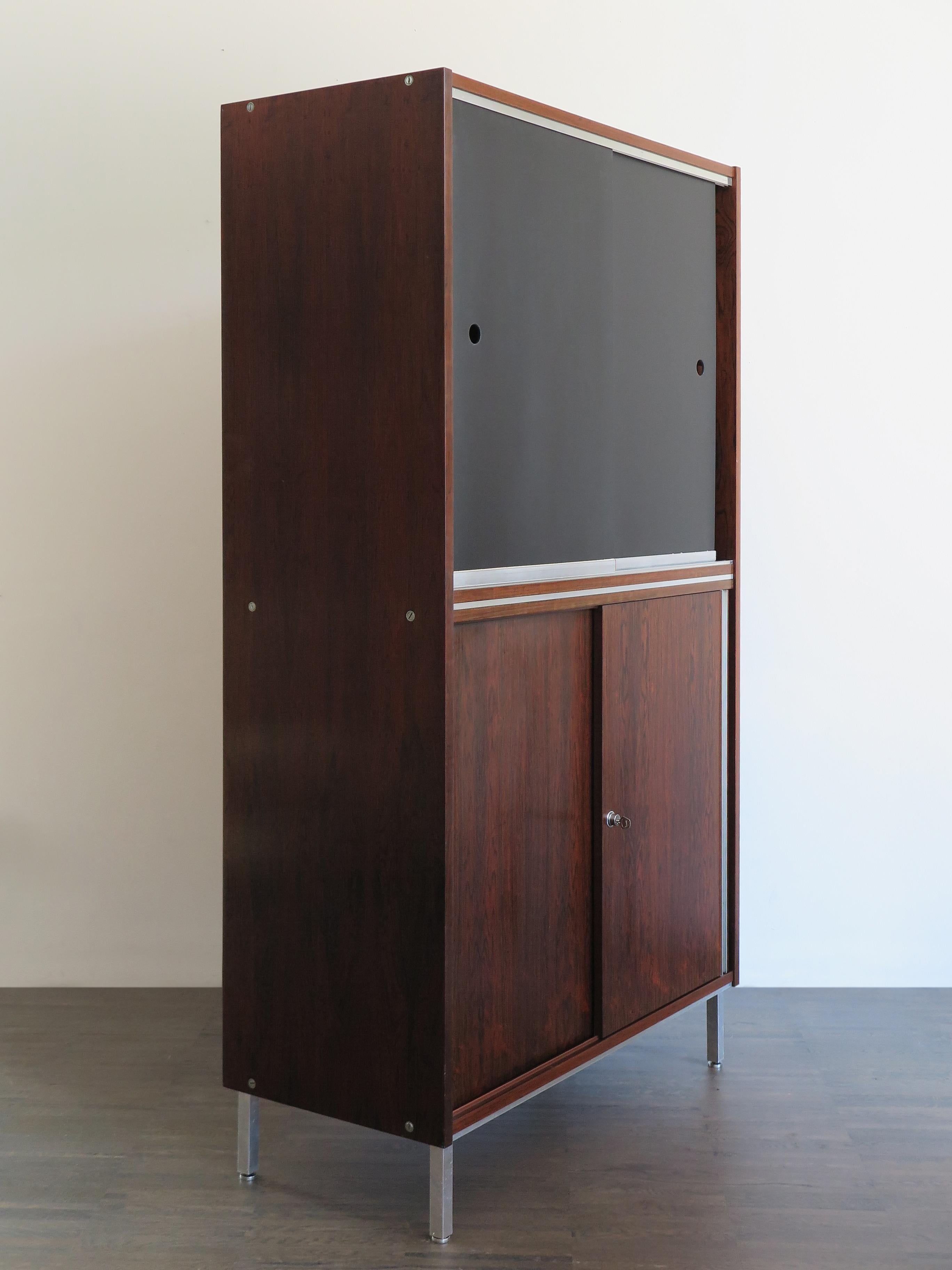 1960s rosewood cabinet or office cabinet designed by George Nelson with metal and aluminium detail and original key,
new black sliding doors.
