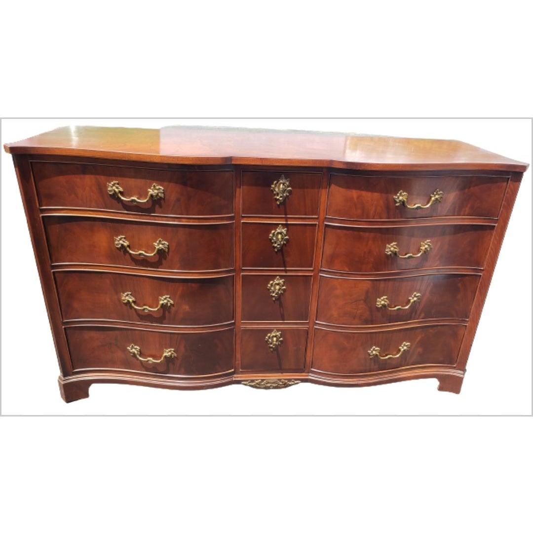 Here is an extremely solid, well made piece of furniture. Made from solid mahogany with 12 dovetail drawers and brass hardware. Hardware original. Seprentine front, bracket feet. Nice! Measures 62 wide x 21 depth 36 height
 Excellent vintage