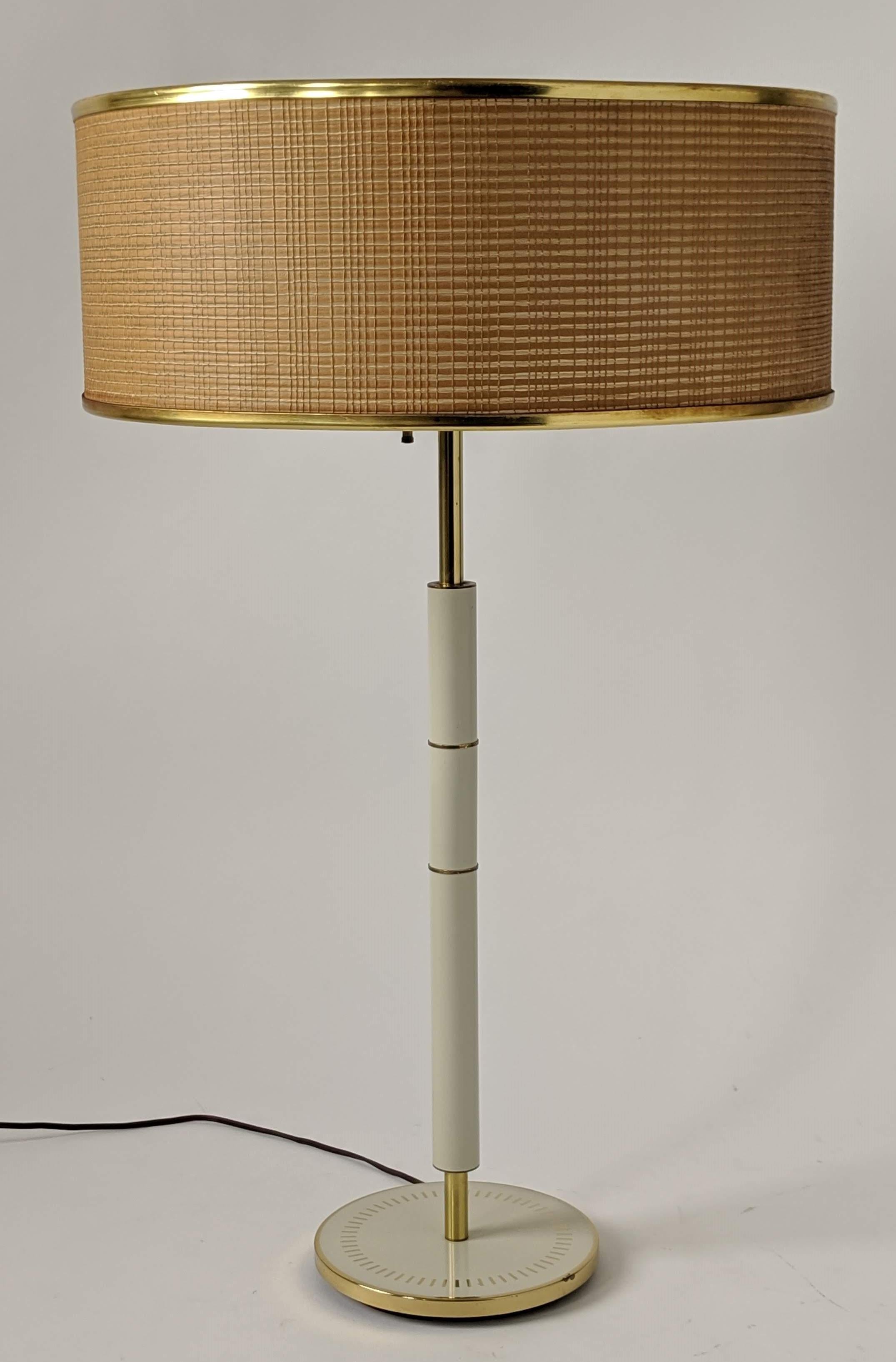 30 in. tall table lamp from Gerald Thurston for Lightolier . 

Original shade measure 18 in. wide by 7 in. high . 

Contain 3 E26 size ceramic socket rated at 60 watts each . 

Rotating switch control one , two or tree lights . 

Lightolier