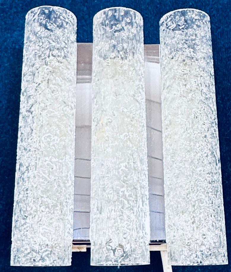 A single 1960s German Doria Leuchten iced/frosted tubular wall light or sconce.  The three frosted glass tubes which are seperated by a strip of polished chromed-metal are suspended onto the white lacquered metal frame.  Each tube has a single hole