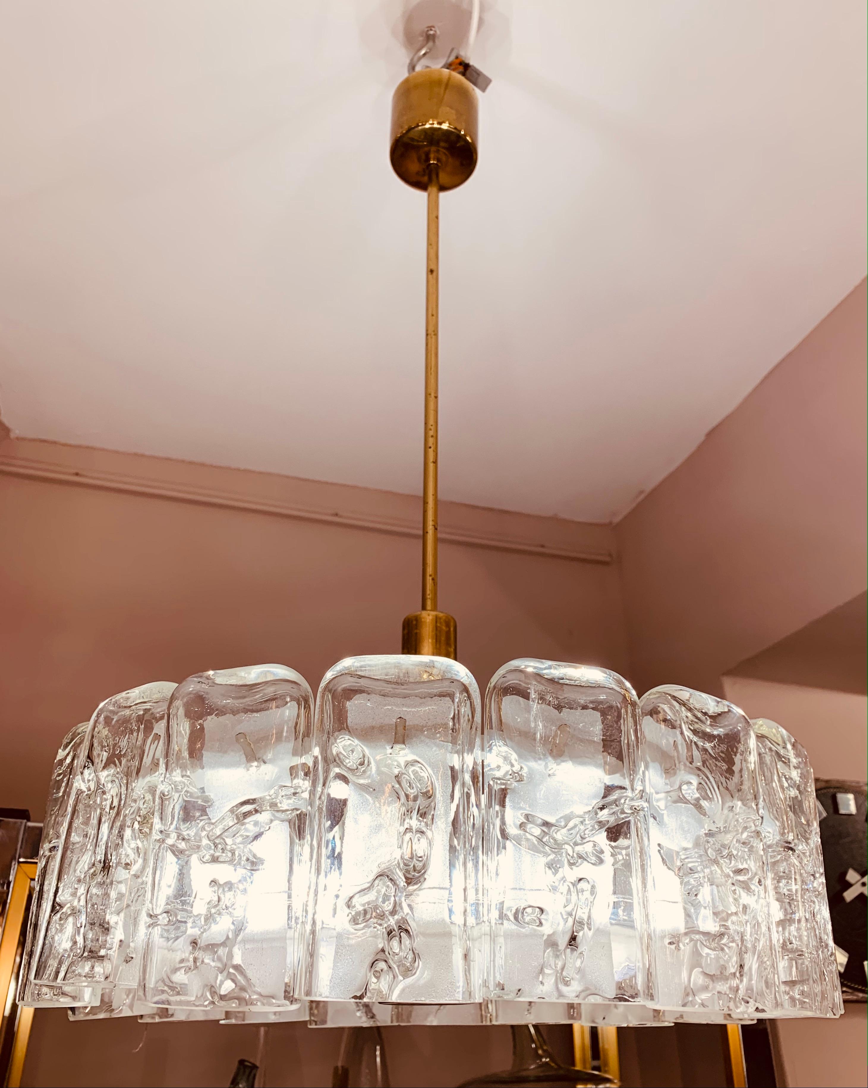 A beautiful, mid century, 1960s German Doria Leuchten iced, crystal, glass & brass chandelier. A single row of 18 hand blown, lollipop shaped, glass lozenges sit around a matching glass disc underneath. A feature brass screw sits in the centre of