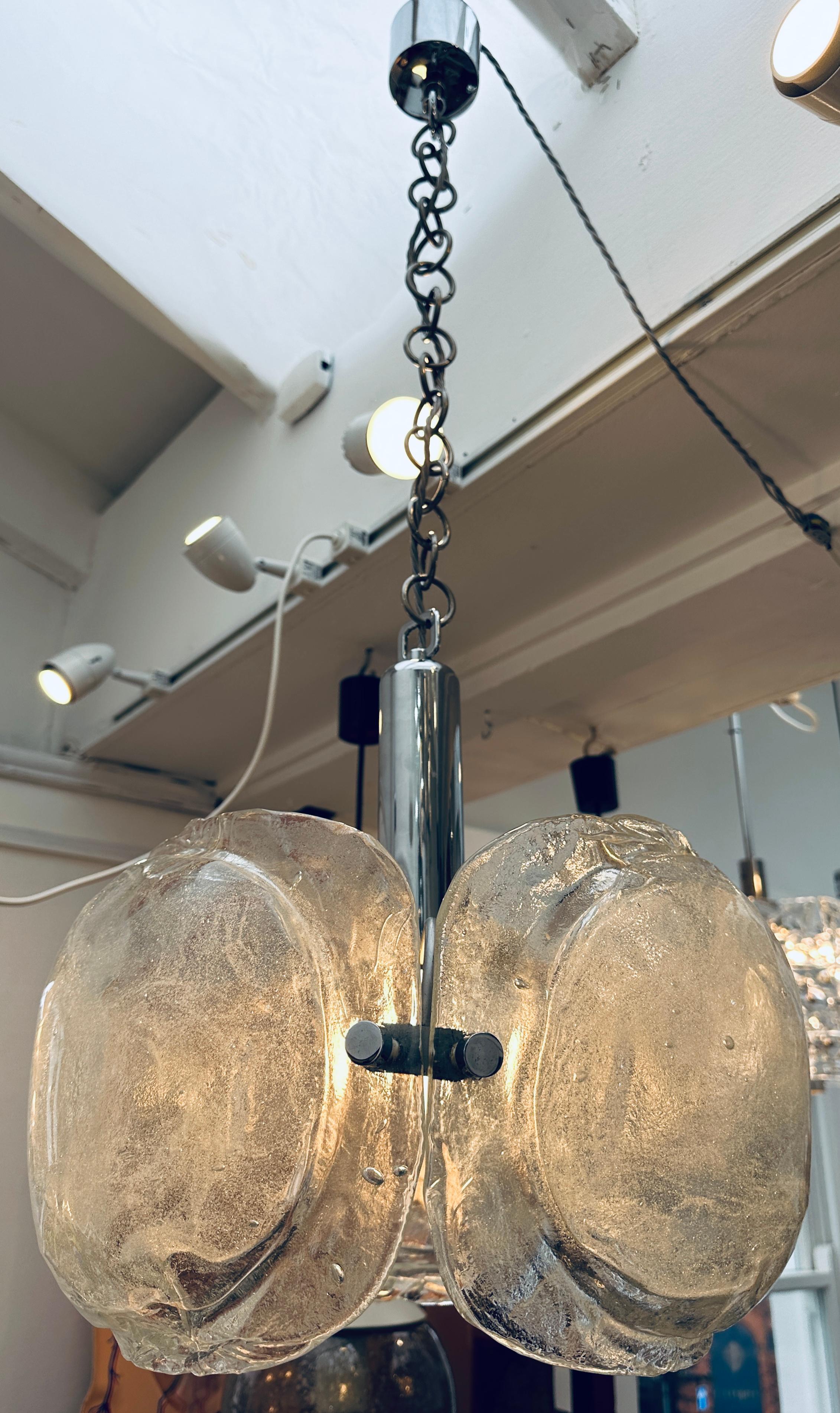 1960s German Kaiser Leuchten Murano glass and chrome chandelier.  The three sections of oval clear and frosted glass are suspended from a thick round-link chrome chain.  Each section of glass has been handblown with a bulbous frosted centre to
